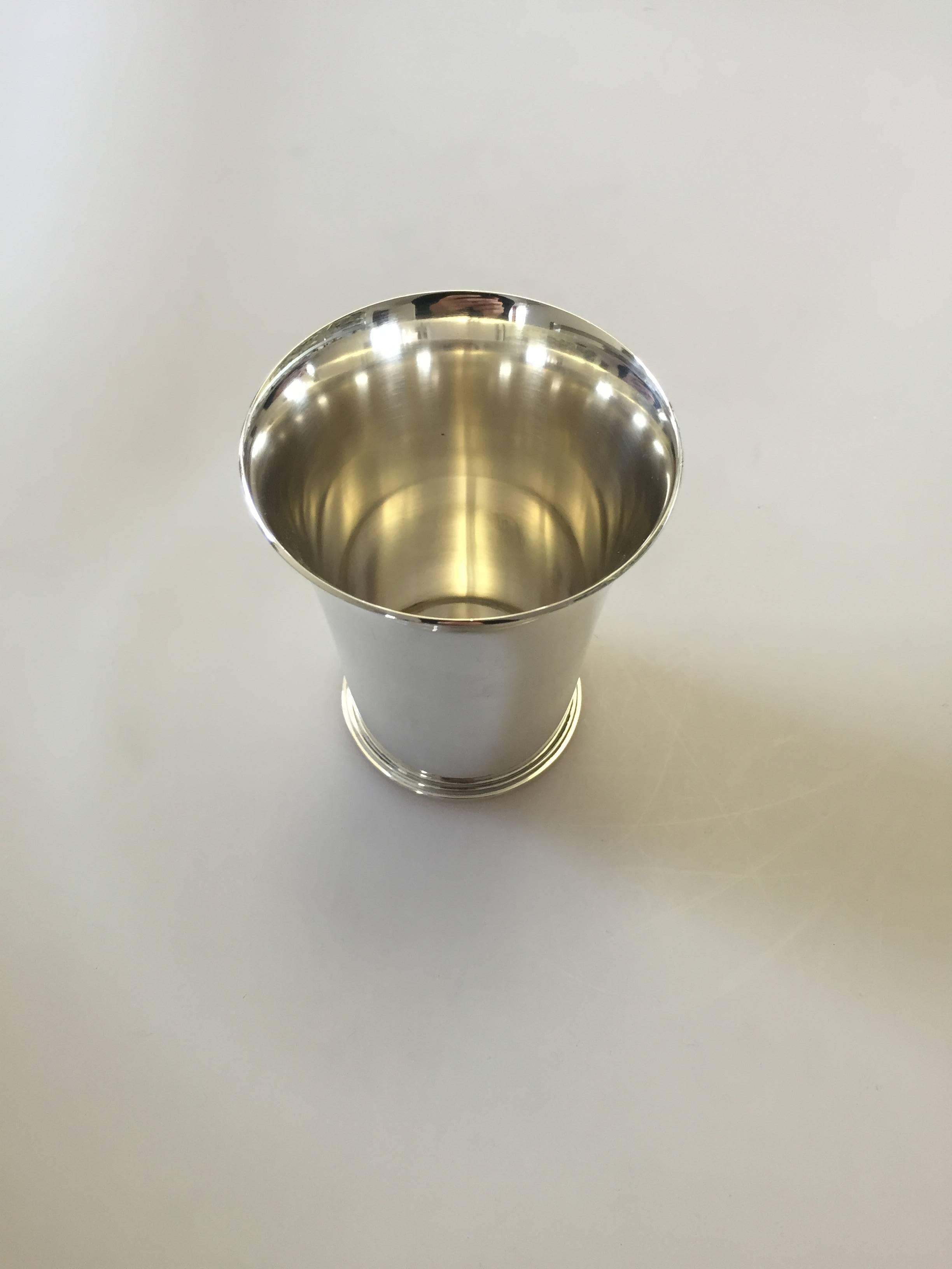 Georg Jensen sterling silver cup #671C designed by Harald Nielsen. The cup measures 9 cm x 7.5 cm and is in a good condition. 

Harald Nielsen (1892-1977) was the originator of some of the most successful designs for Georg Jensen in the 1920s and