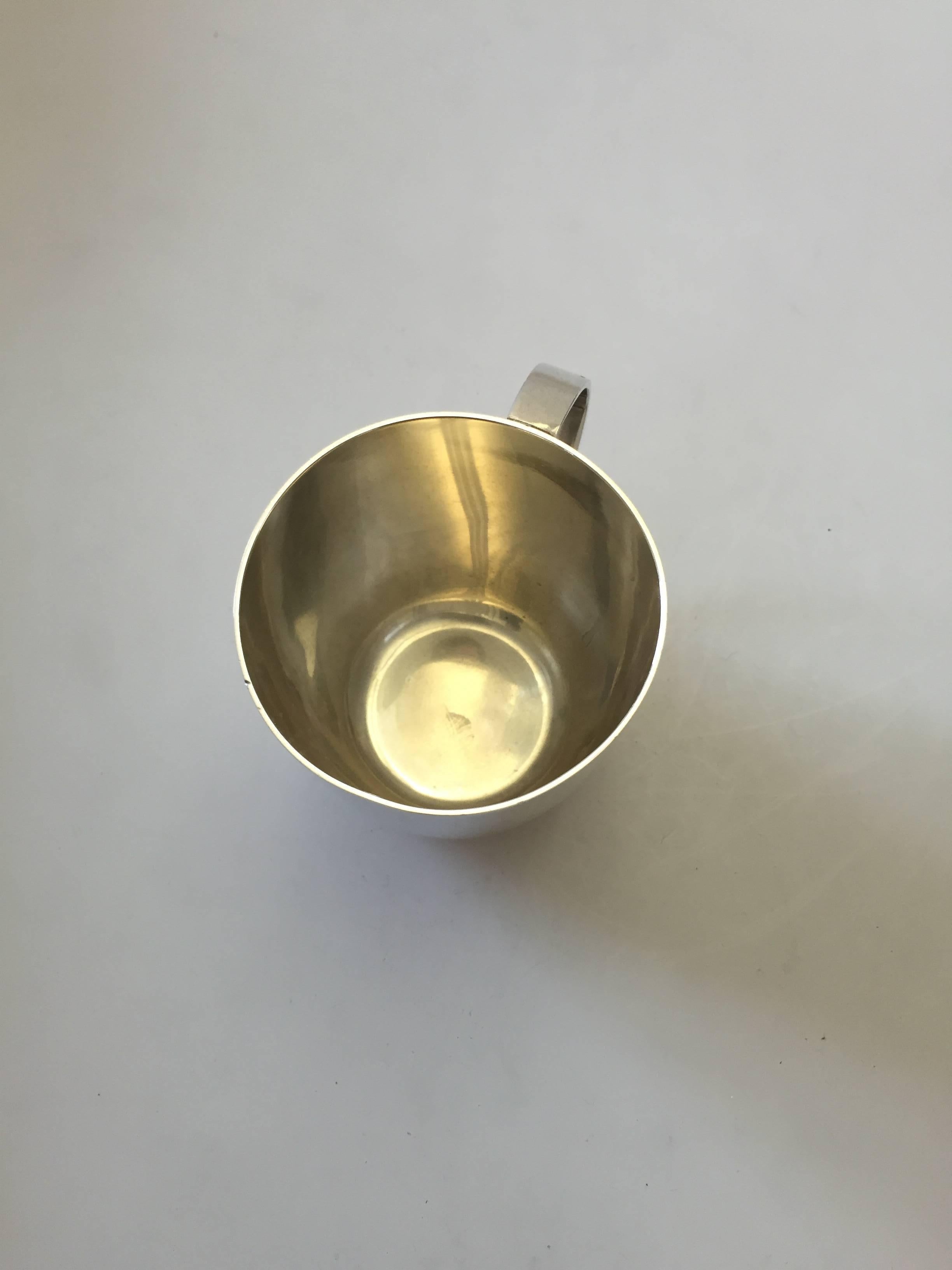 Georg Jensen sterling silver cup with handle #1126. Measures 6.5 cm / 2 3/5