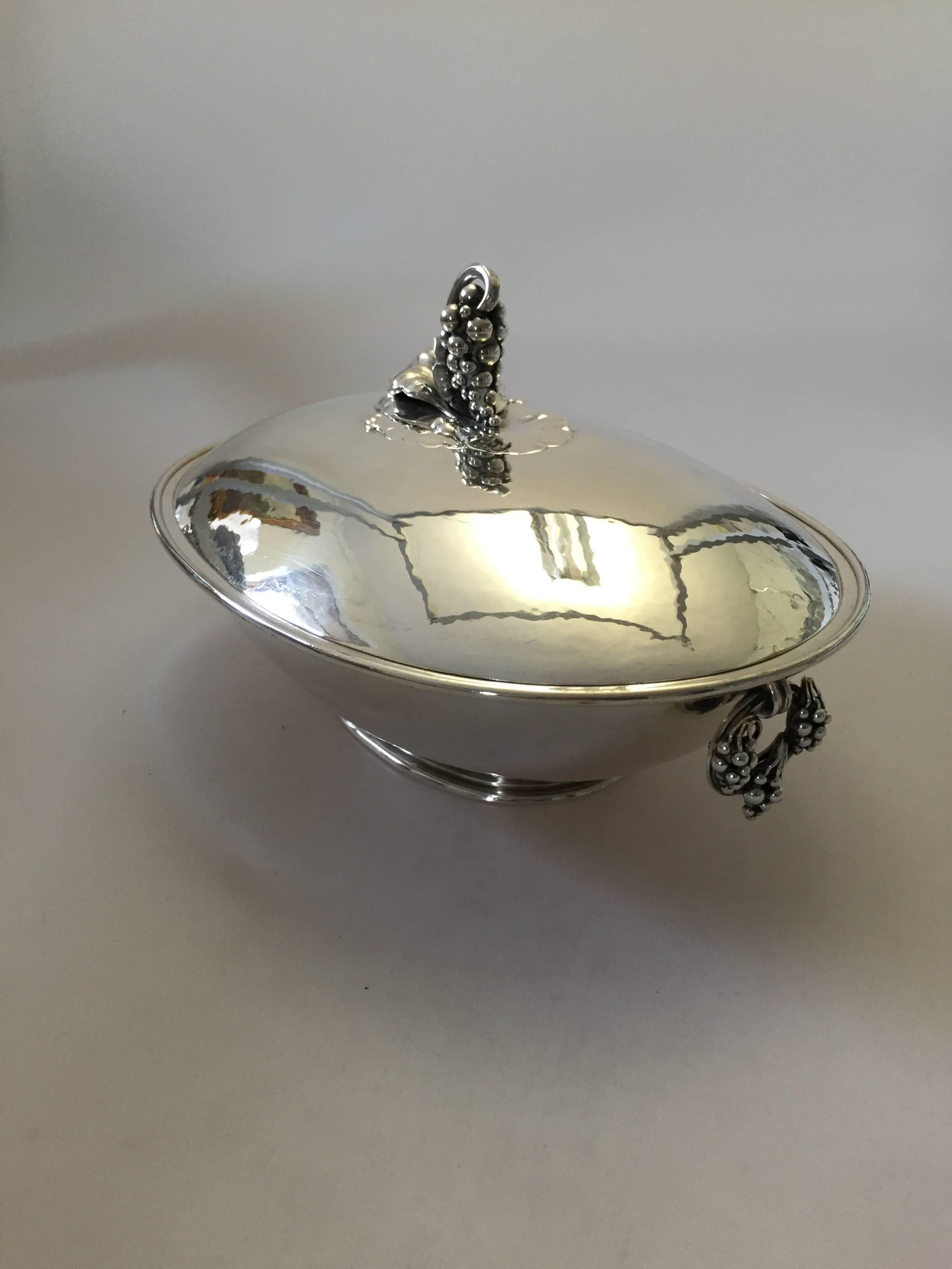 Georg Jensen sterling silver oval serving dish with cover with grape ornament. The dish measures 10 3/8