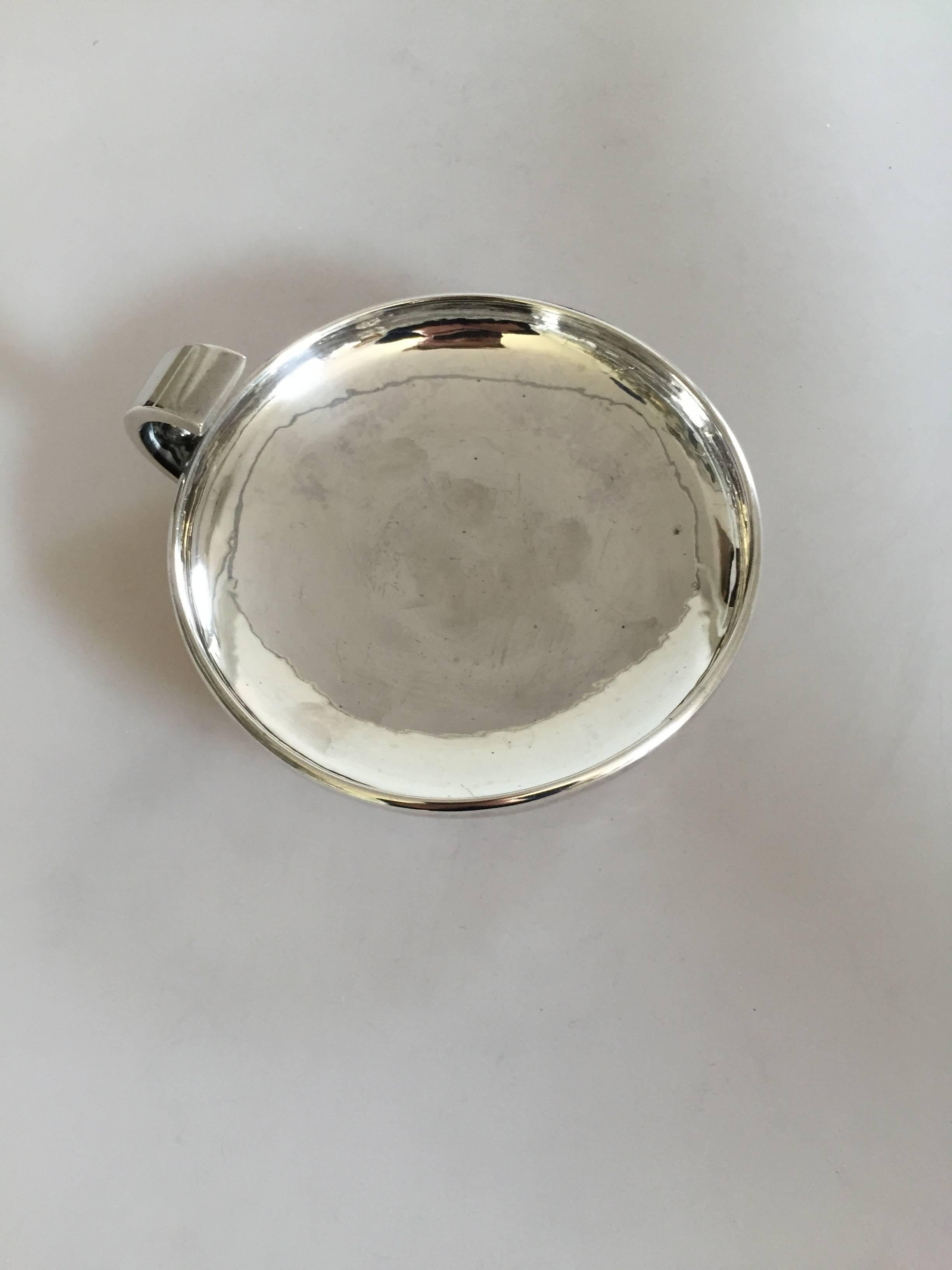 Hans Hansen sterling silver decorative bowl/dish #143 designed by Karl Gustav Hansen. It measures 13.5 cm in diameter and is in a good condition.

Hans Hansen (1884-1940) was a Danish silversmithy. He opened his own smithy and shop in Kolding,