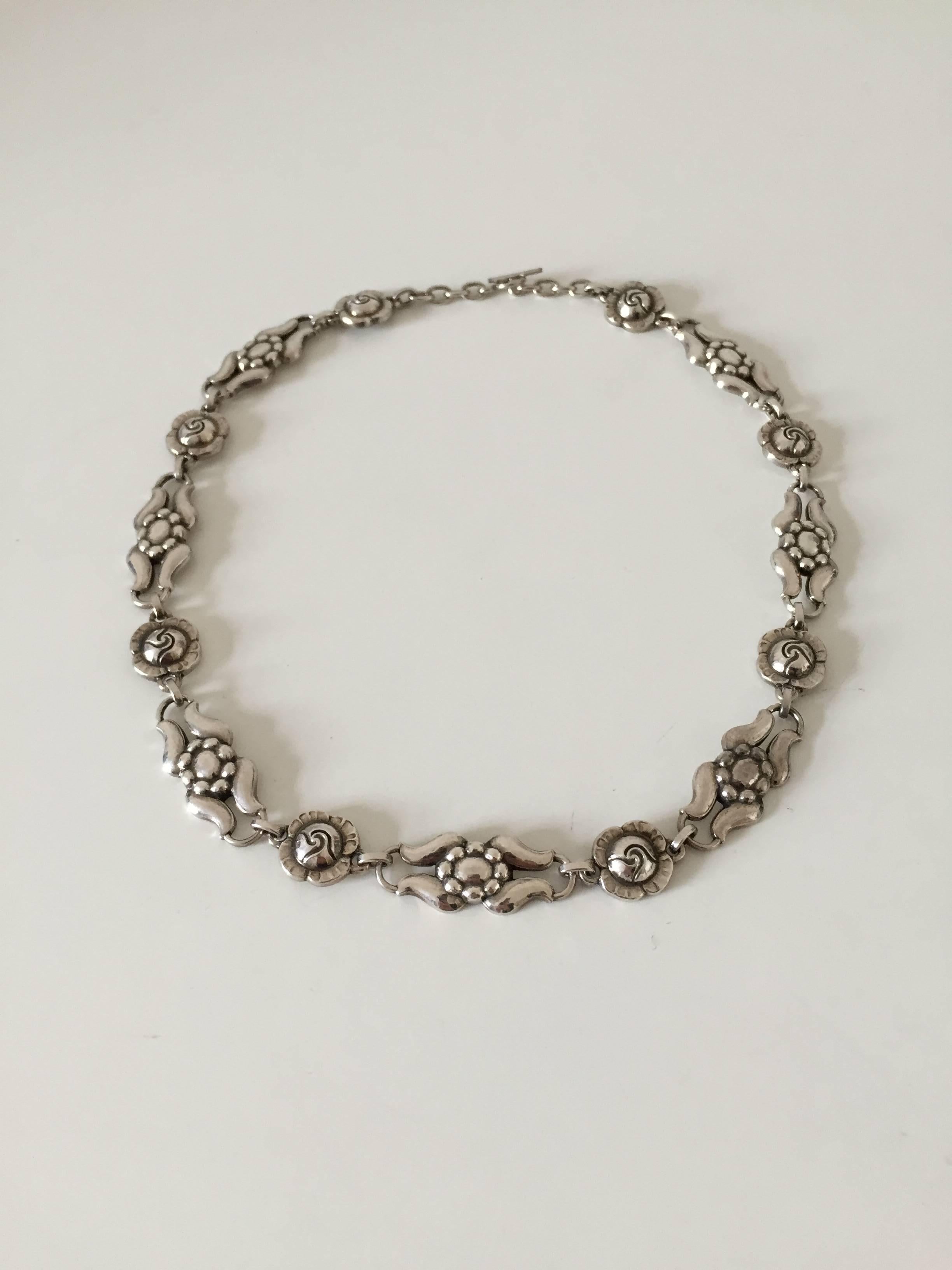 Georg Jensen sterling silver necklace. The necklace is from 1910-1925 and is in a good condition. It measures 42 cm long, weighs 29.5 g / 1.04 oz.

Georg Jensen (1866-1935) opened his small silver atelier in Copenhagen, Denmark in 1904. By 1935