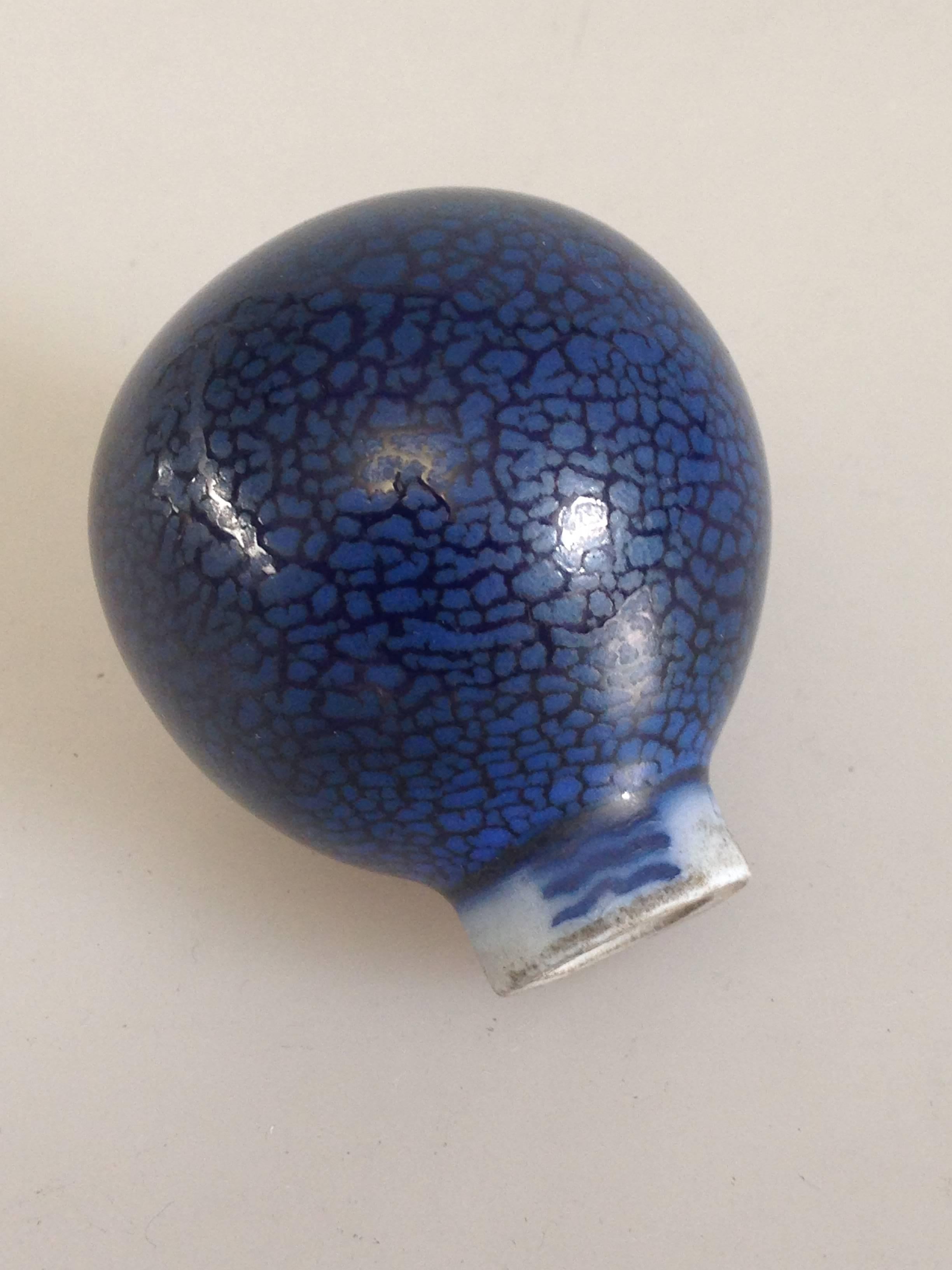 The snakeskin glaze is done by Valdemar Engelhart. A very rare piece, only Royal Copenhagen cane handle we know of with snake or crystalline glaze.