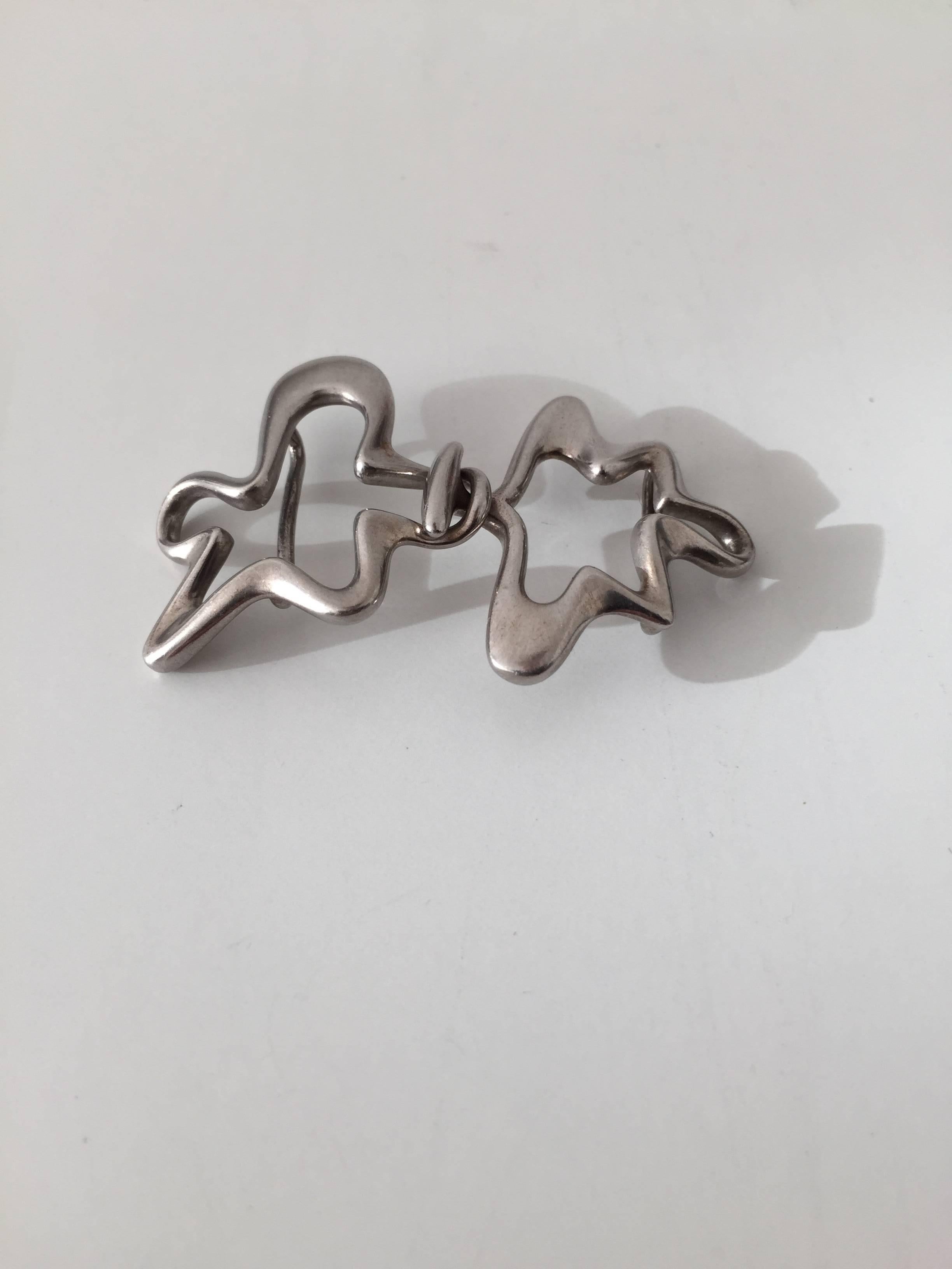 Georg Jensen sterling silver belt buckle #429 designed by Henning Koppel.

Measures 5.3 cm long, 3 cm wide.
Weighs 0.41 oz.

Henning Koppels (1918-1981) modern designs broke new ground for Georg Jensen. His designs were constructed in clean