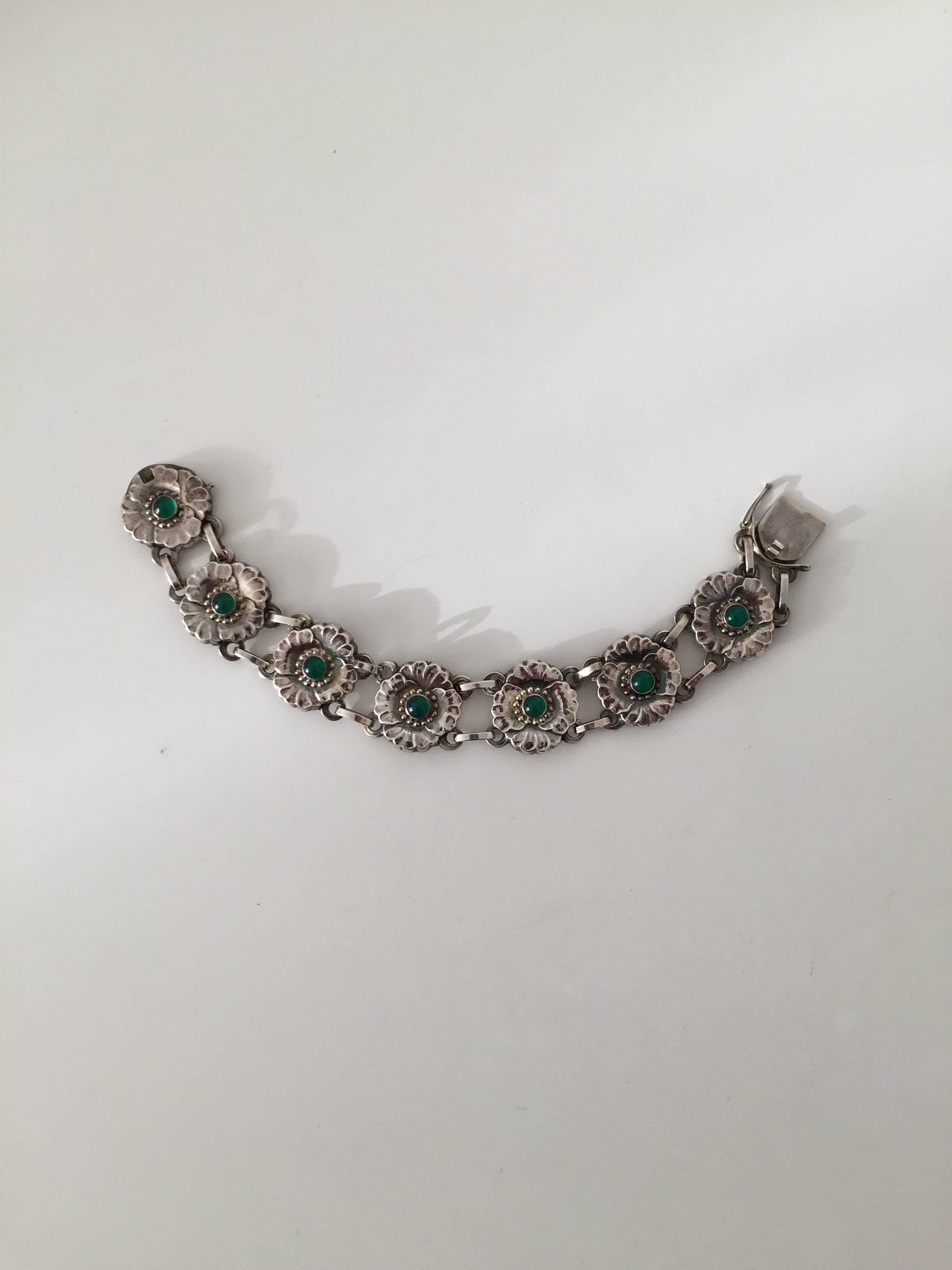 silver bracelet with green stone