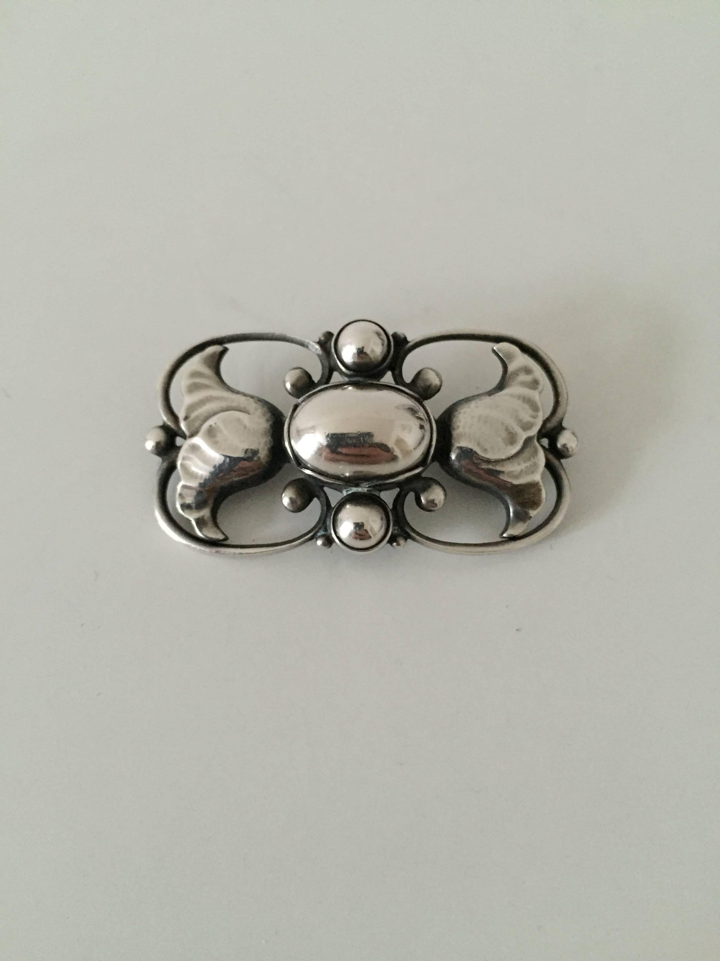 Georg Jensen sterling silver brooch #236A. 

Measures: 4 cm x 2 cm.
Weighs 9g / 0.30oz.

Georg Jensen (1866-1935) opened his small silver atelier in Copenhagen, Denmark in 1904. By 1935 the year of his death, he had received world acclaim and