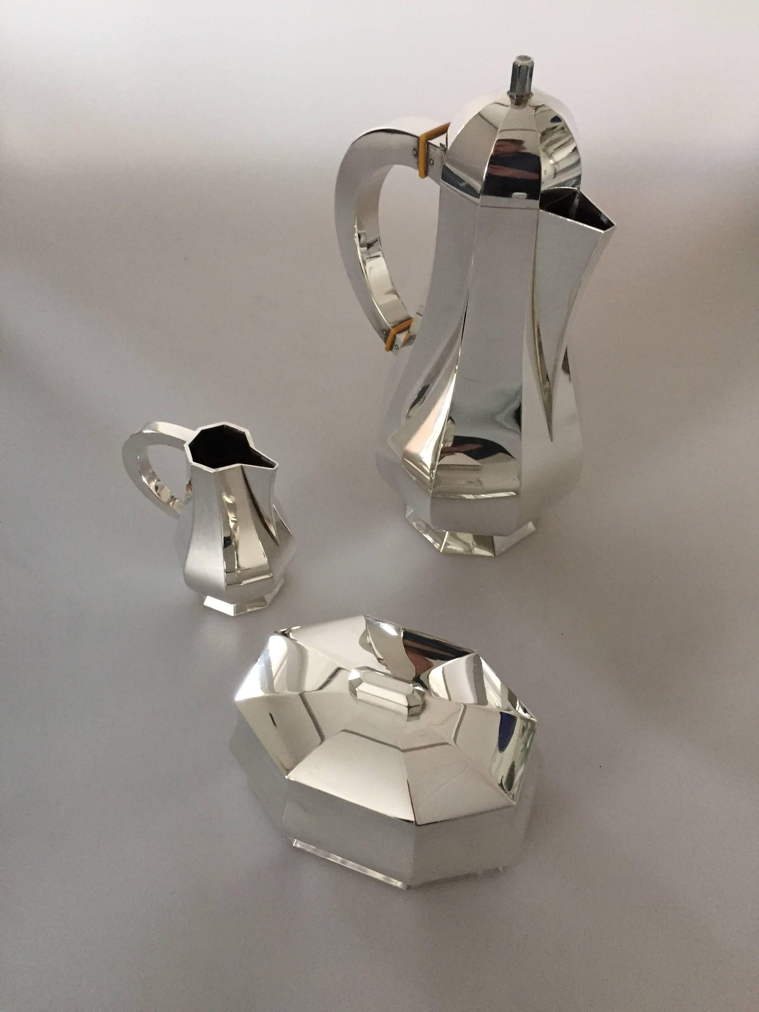 Wiwen Nilsson sterling silver coffee set with coffee pot, creamer and sugar bowl with cover. All parts are inperfect condition. From circa 1940s-1950s.

Coffee pot measures 26 cm tall, 12 cm in diameter at widest point.
Sugar bowl measures 8 cm