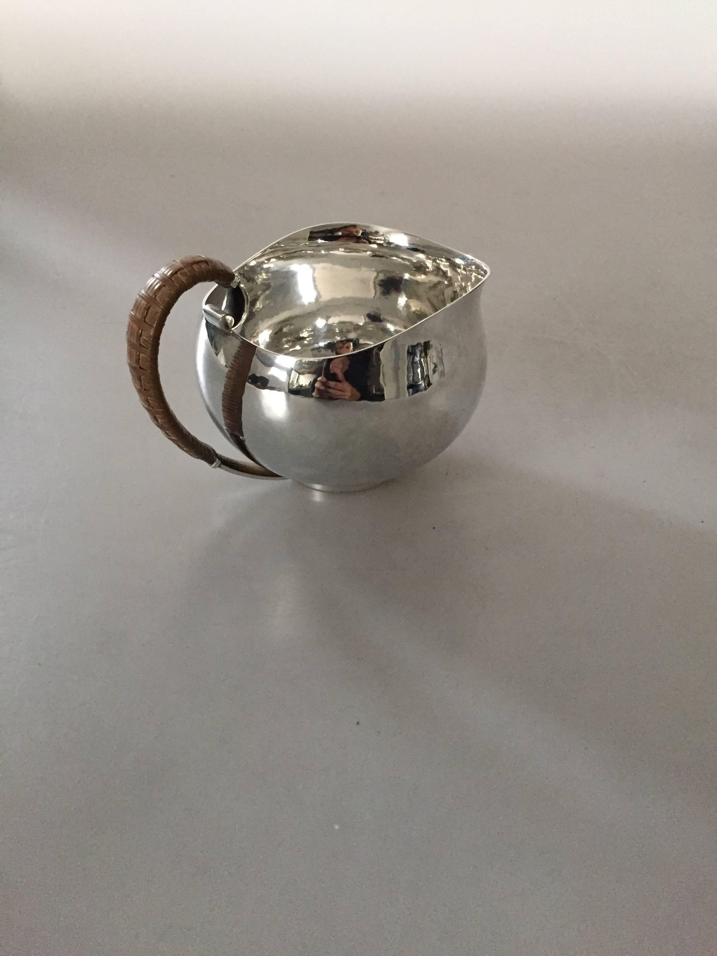 Hans Hansen sterling silver sauce pitcher #366 by Karl Gustav Hansen. Is in good condition. 

Measures: 12, 5 cm x 8 cm. 

Hans Hansen (1884-1940) was a Danish silversmithy. He opened his own smithy and shop in Kolding, Denmark in 1906. Starting