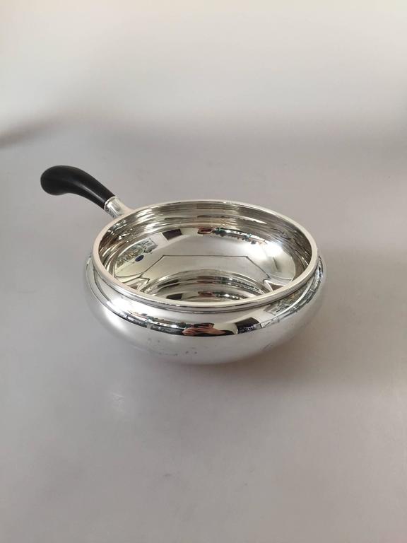 Danish Svend Toxvaerd (Toxværd) sterling silver sauce pan with handle.

Weighs 342 g / 12.05 oz.

Sauce pan bowl measures 19 cm (7½ in) across Handle measures 15 cm (5 29/32 in). Height 7cm (2 3/4 in)