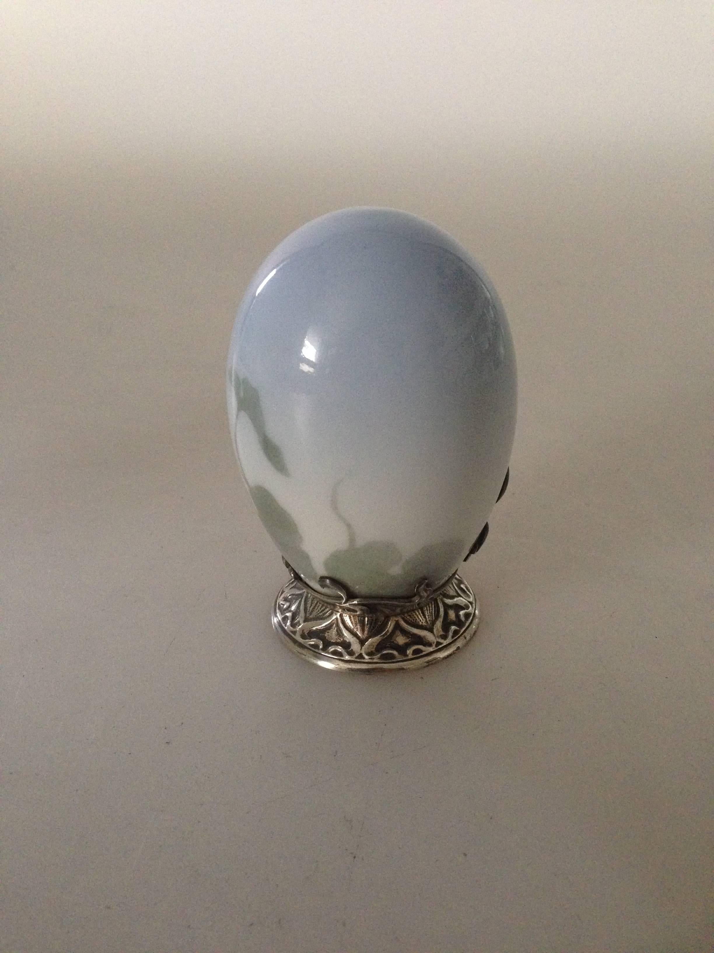 Royal Copenhagen Art Nouveau egg with Anton Michelsen silver mounting from 1902. This is pure luxury. Also see the other egg we have for sale.