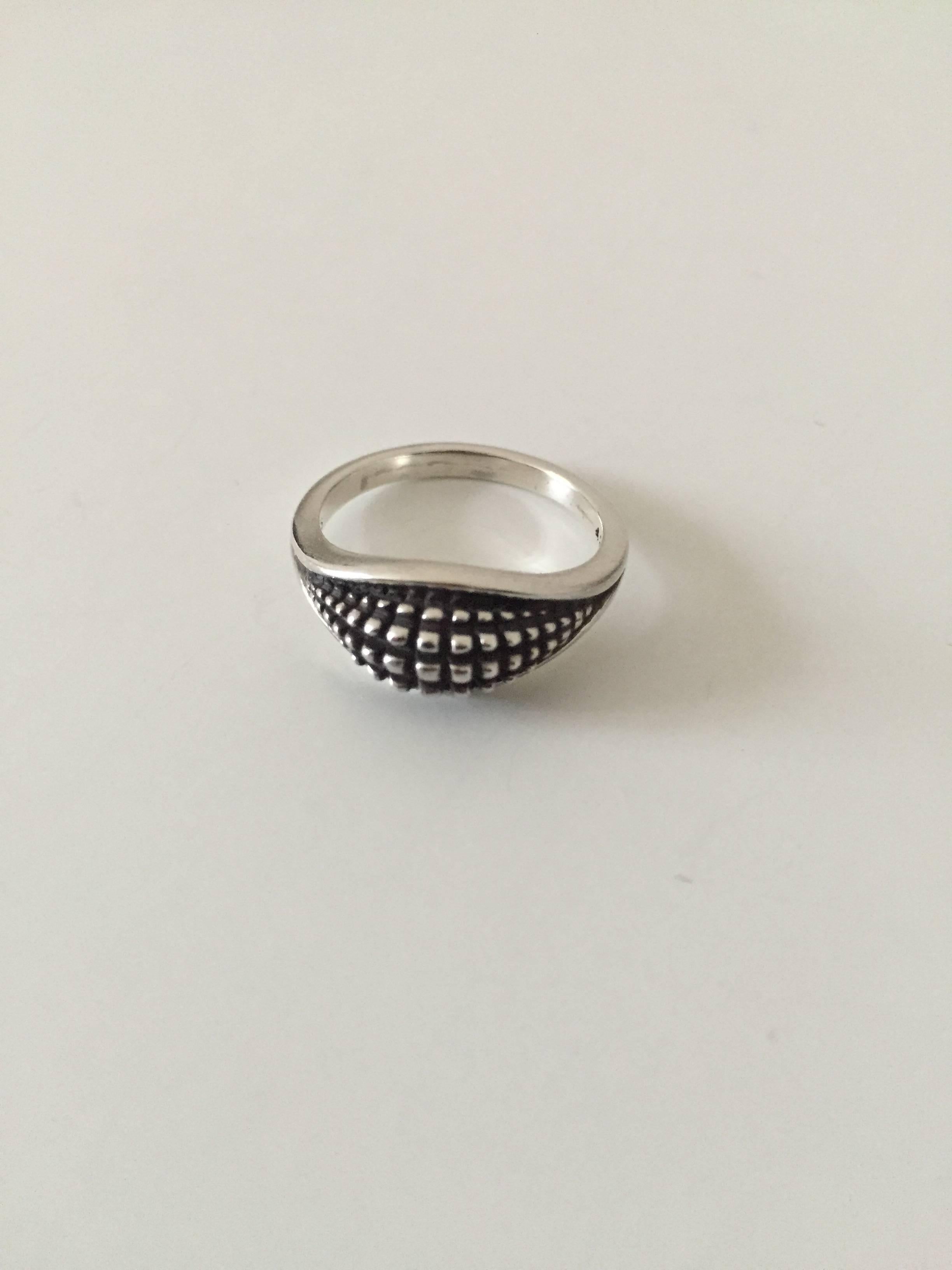 Georg Jensen sterling silver ring #425. 

Size 59. 
Weighs 5 g / 0.20 oz.

Georg Jensen (1866-1935) opened his small silver atelier in Copenhagen, Denmark in 1904. By 1935 the year of his death, he had received world acclaim and was hailed in