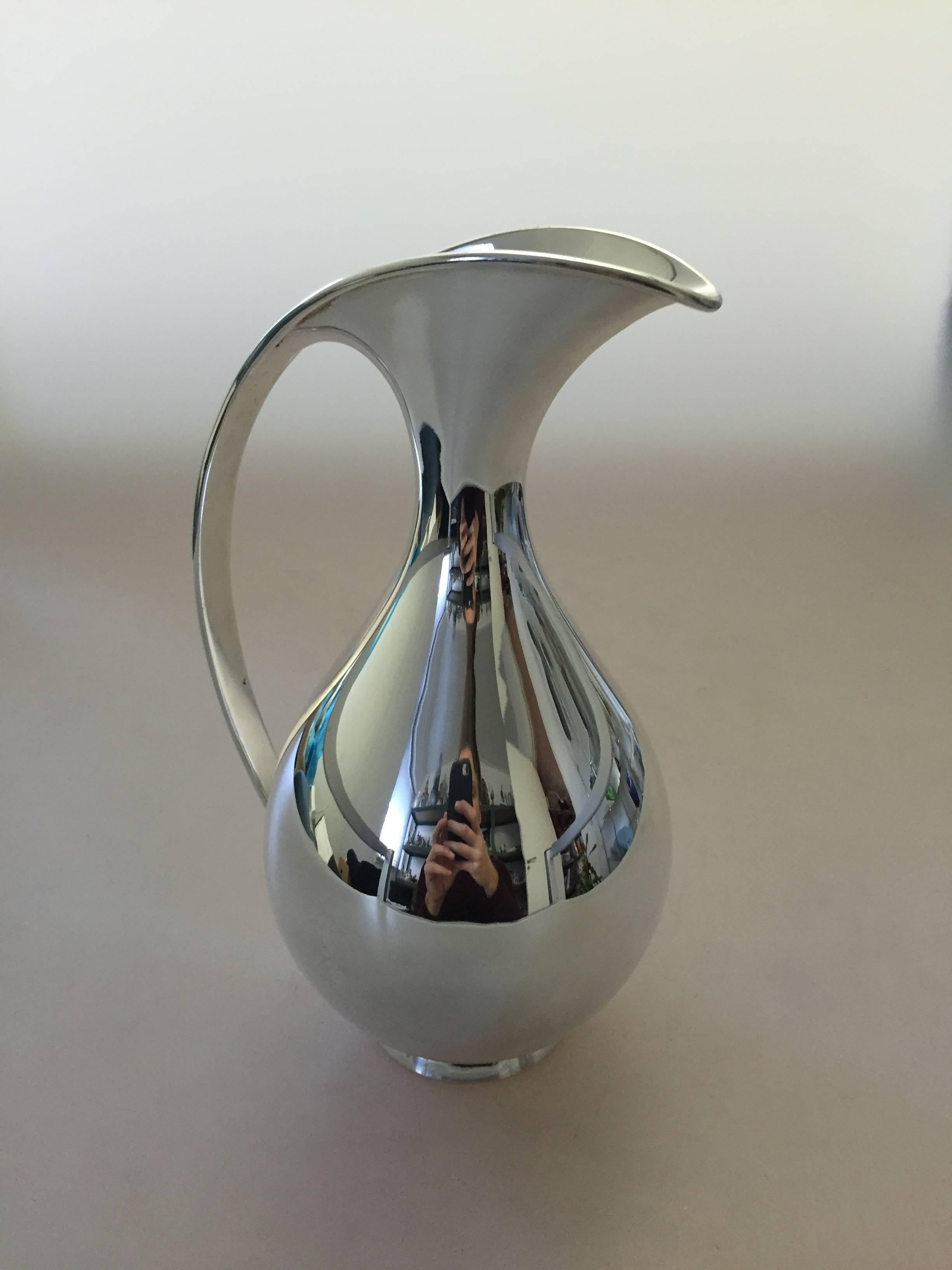 Kay Fisker sterling silver water pitcher from Anton Michelsen. The pitcher is in perfect condition and holds 1 Liter. 

Measures 25 cm H.