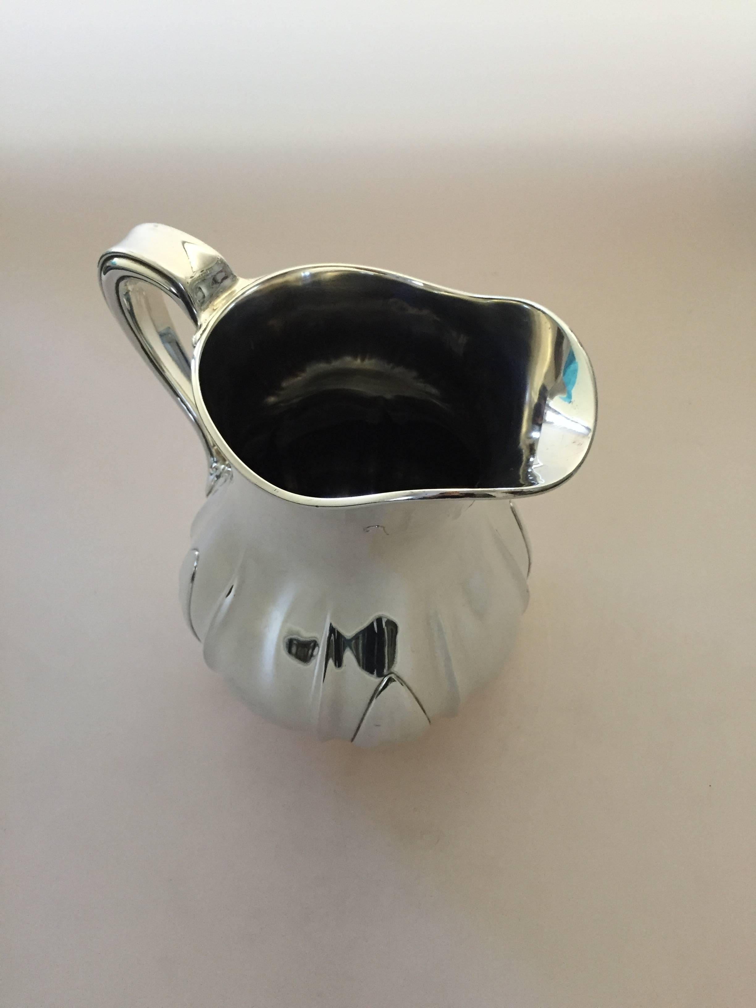Tiffany sterling silver John Moore 1907-1938 water pitcher #11349D. 

Measures 22,5 cm H.