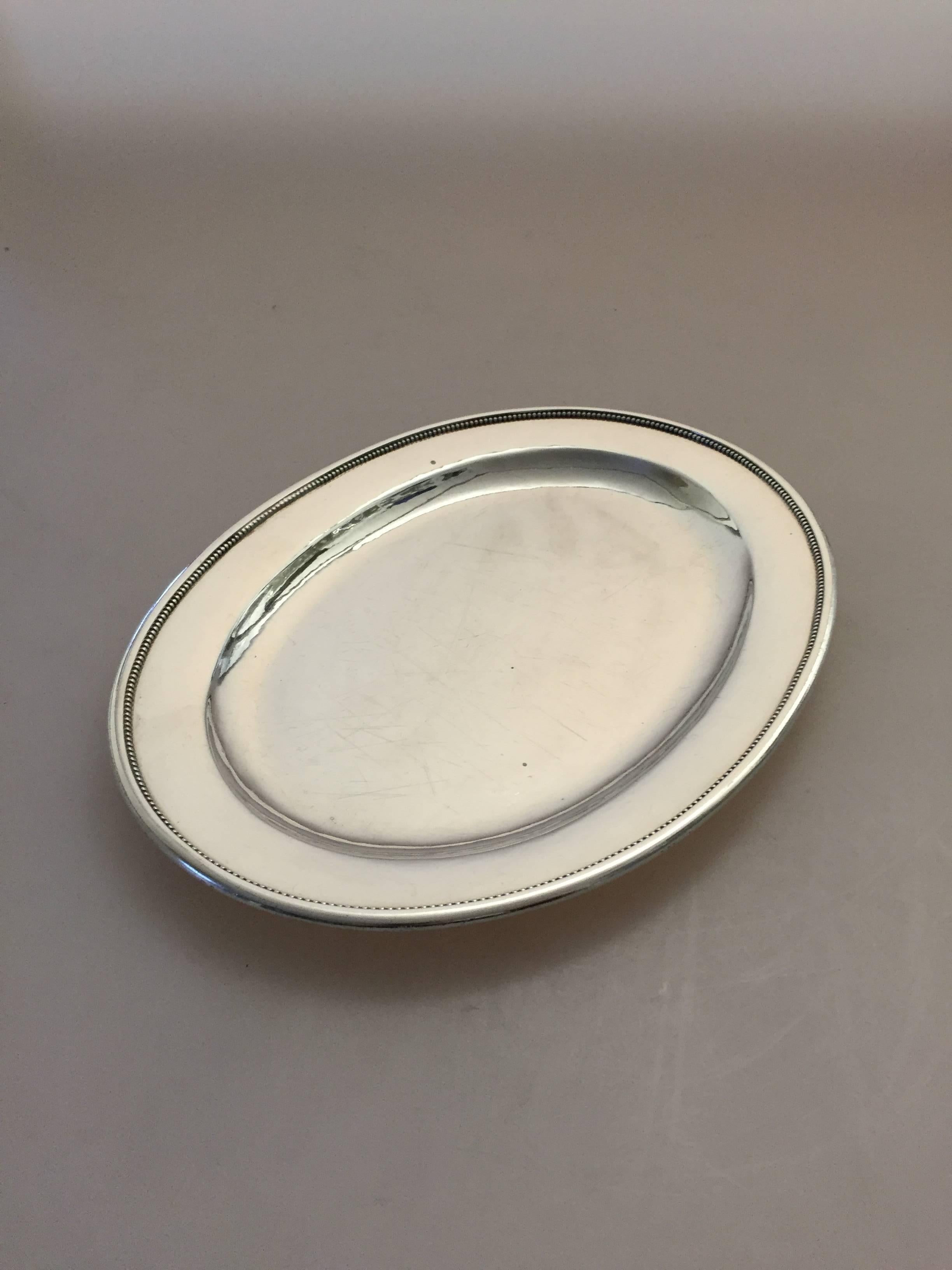 Georg Jensen sterling silver serving tray #210D.

Measures: 29.5 cm x 20 cm.