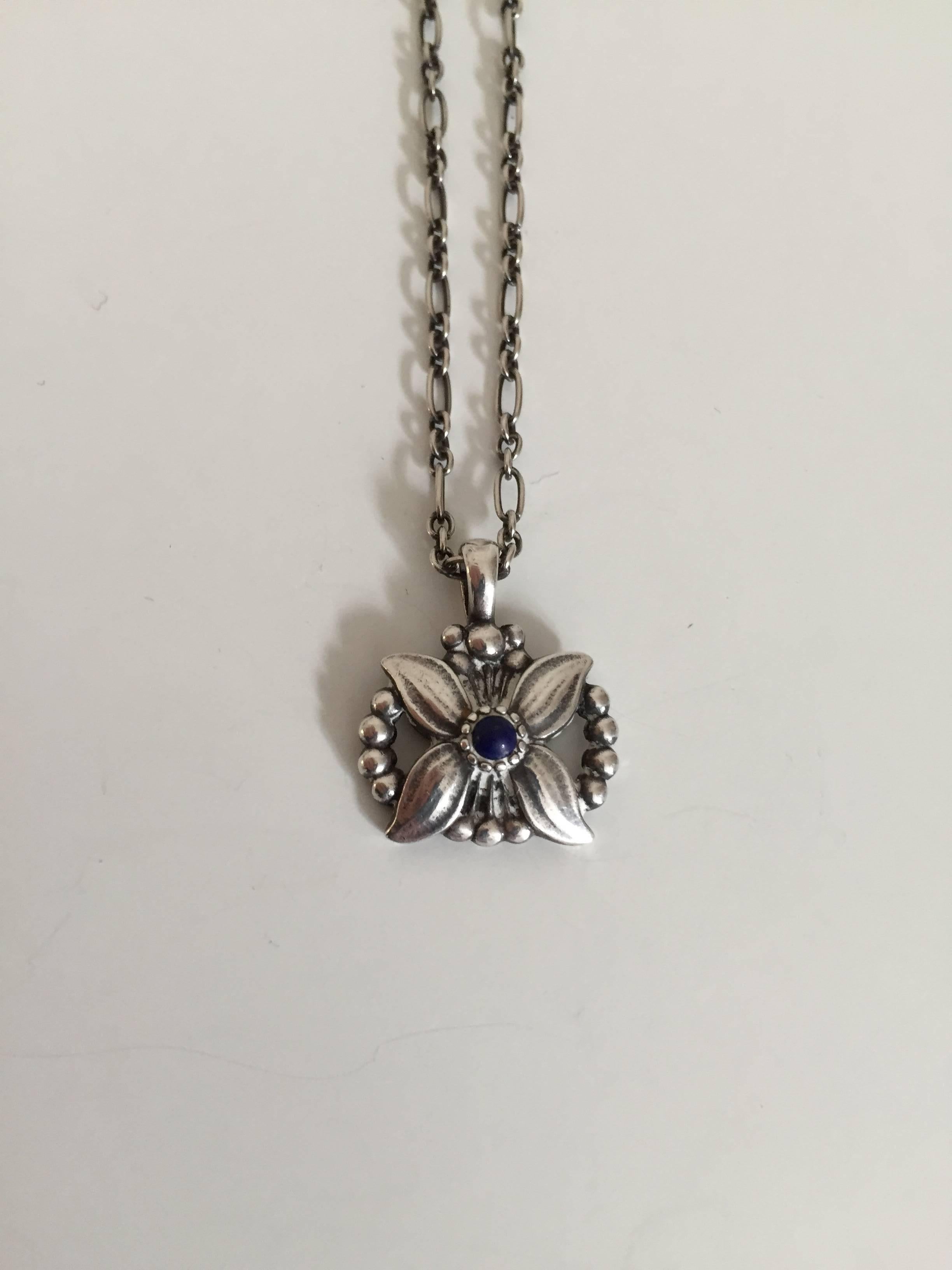 Georg Jensen annual pendant sterling silver with lapis lazuli, 1998. 

Chain is 44 cm long (17 21/64