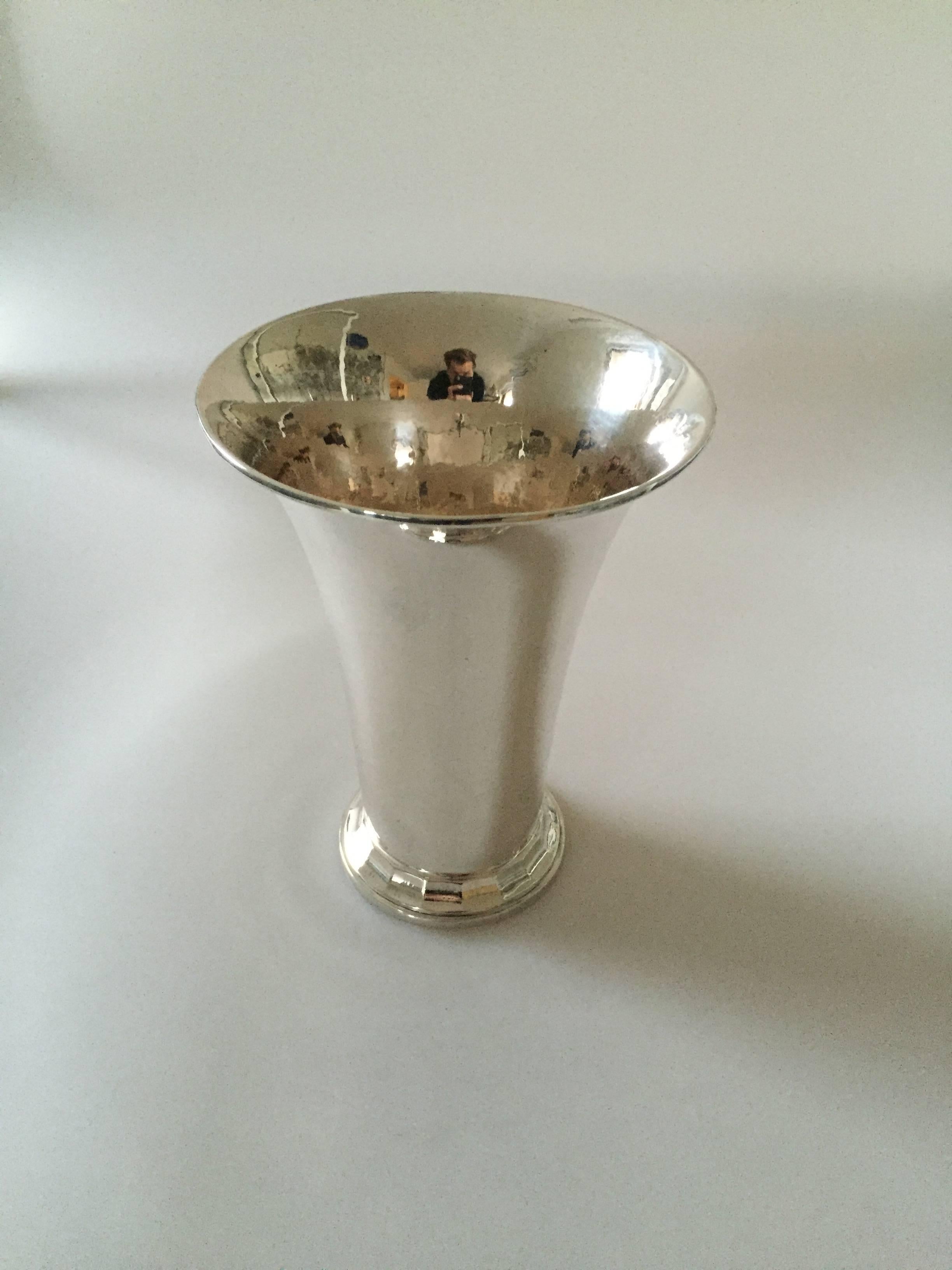 Georg Jensen hammered silver vase from 1929. 

Measures: 18.8 cm H and 14.5 cm in diameter.