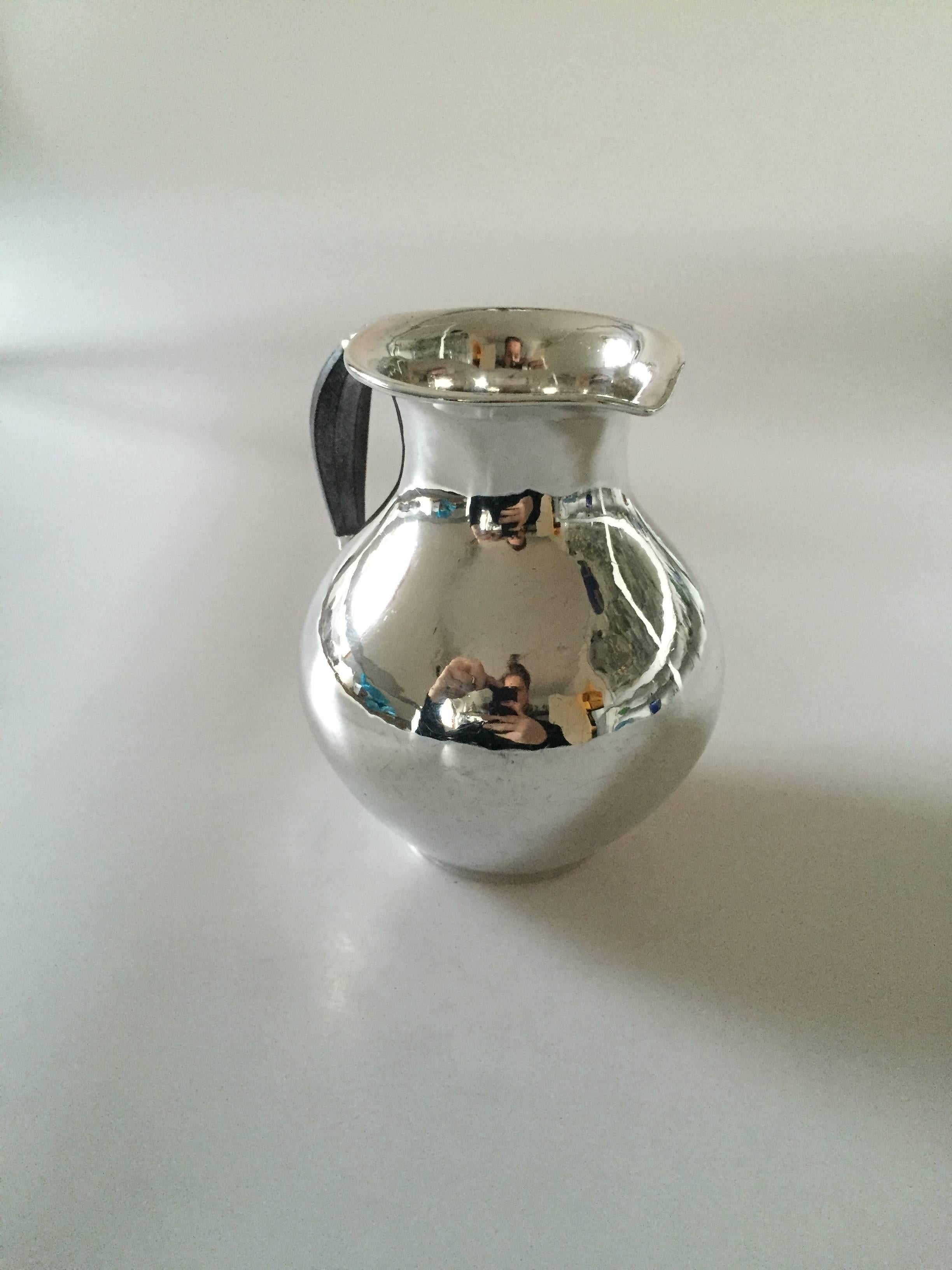 Georg Jensen sterling silver pitcher #385B. From the 1920s.

Measures: 14 cm H.