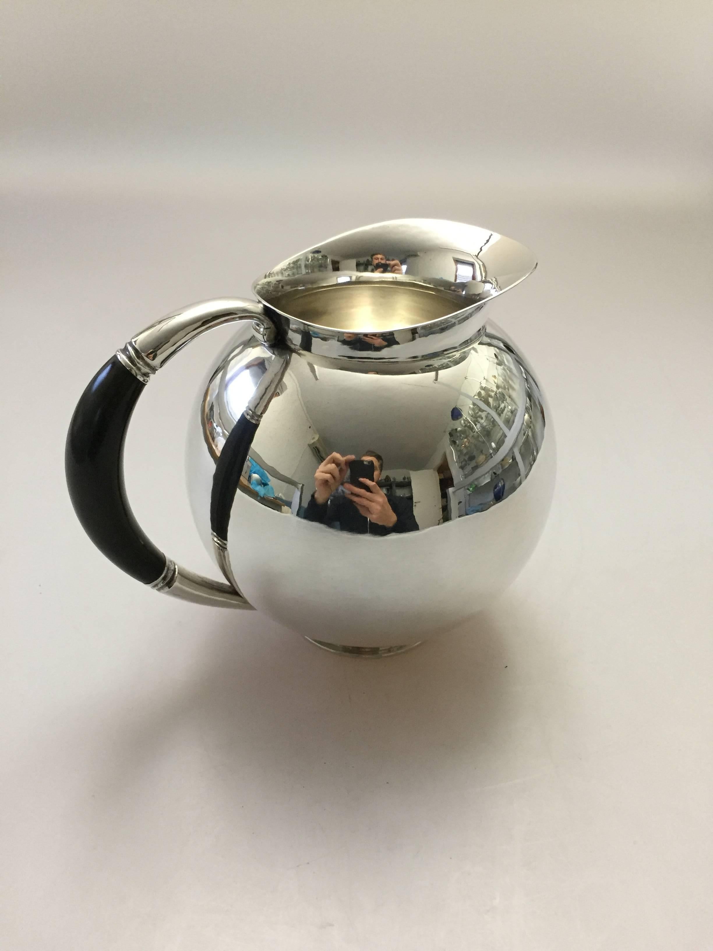 Georg Jensen sterling silver pitcher #533. With marks from 1925-1933.

Measures: 15 cm / 5 9/10