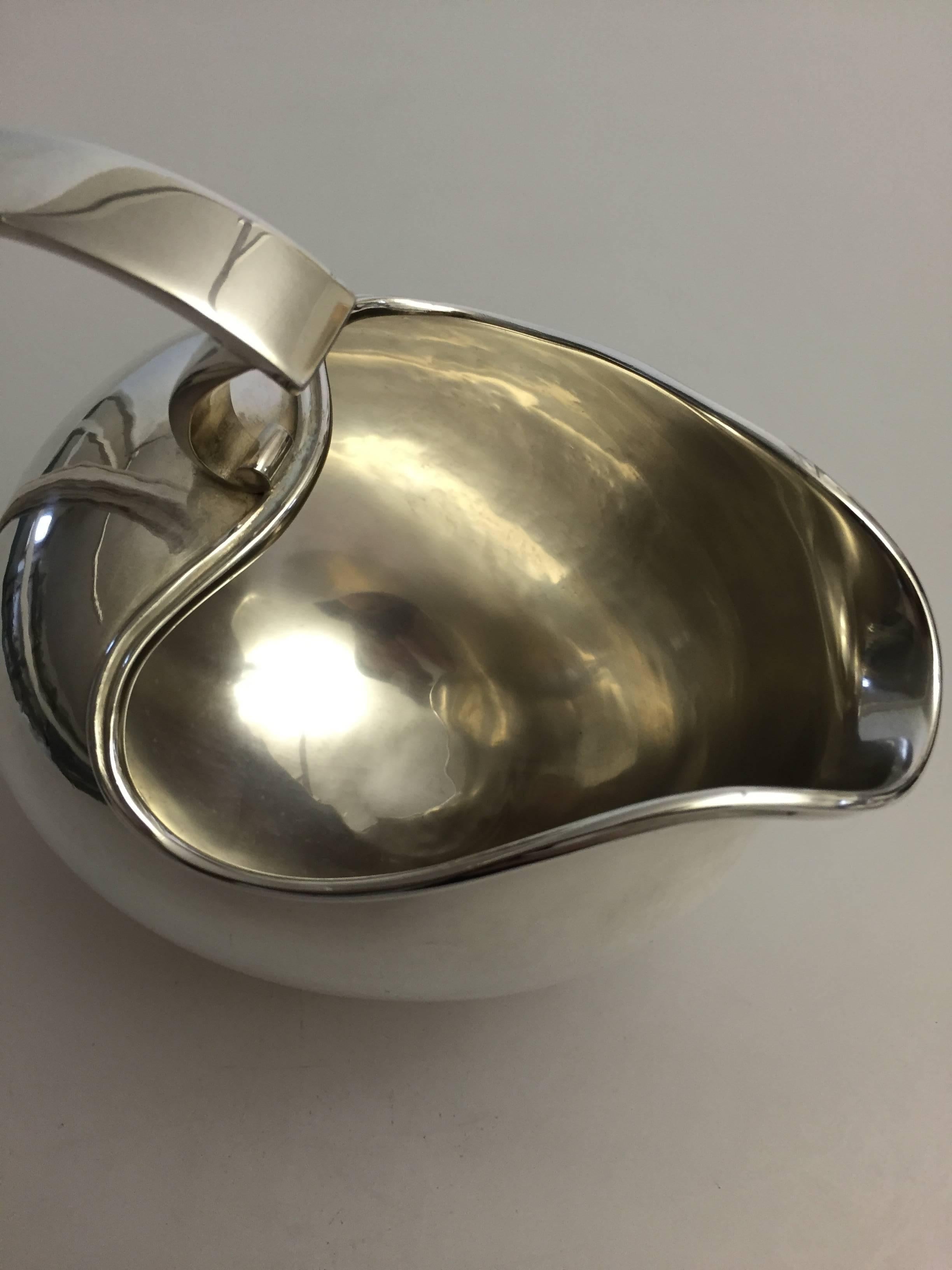 Georg Jensen sterling silver pitcher or large sauceboat designed by Harald Nielsen #606A. 

Weighsc496 g/17.5 oz. 

