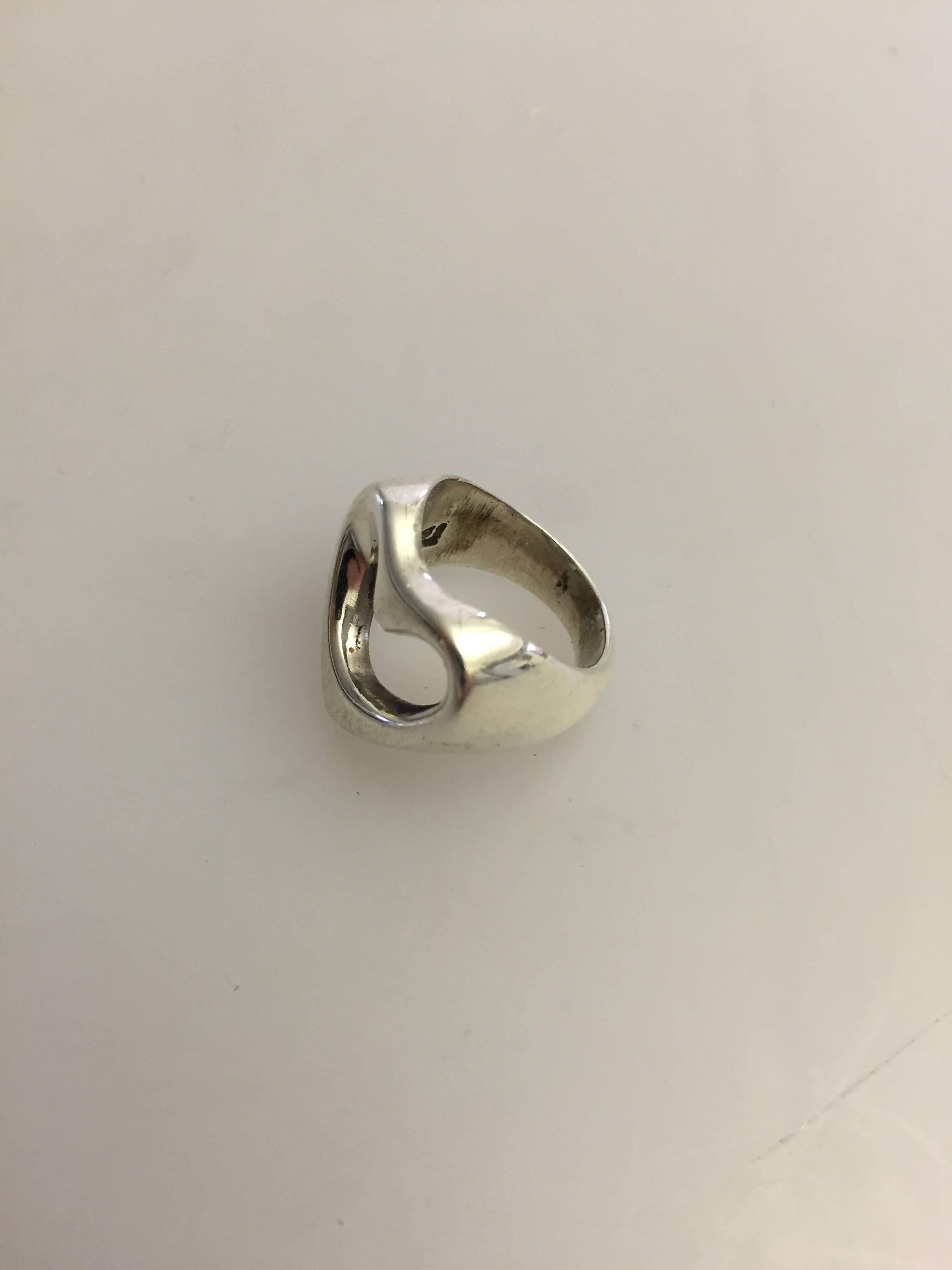 Georg Jensen sterling silver heart ring #193 designed by Henning Koppel.

 Size 45 and size 42.
 Vejer 8.9 g / 0.31 oz.

Henning Koppels (1918-1981) modern designs broke new ground for Georg Jensen. His designs were constructed in clean lines