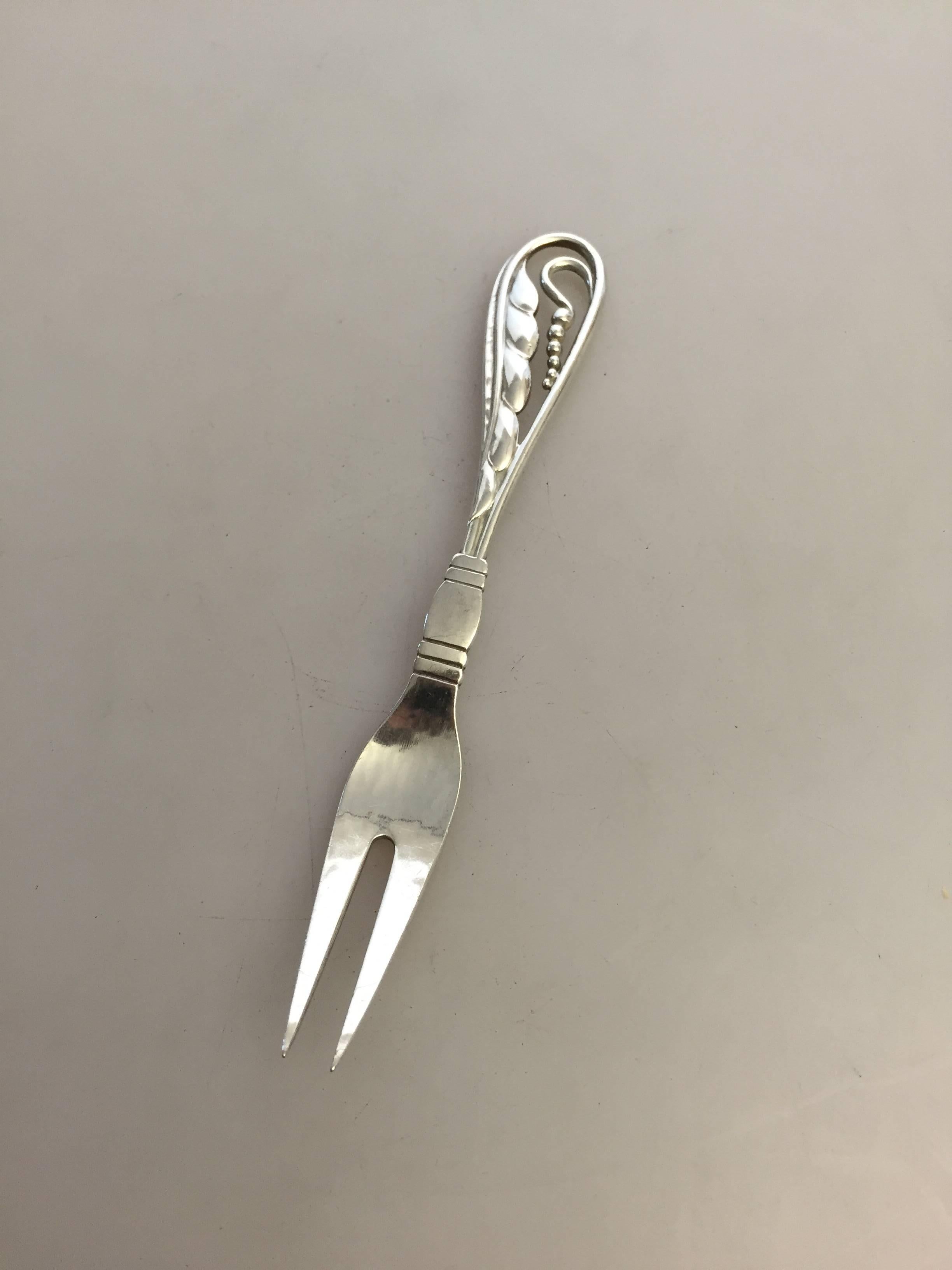 Georg Jensen ornamental silver fork #70. From 1925. 

Measures 15 cm / 5 9/10