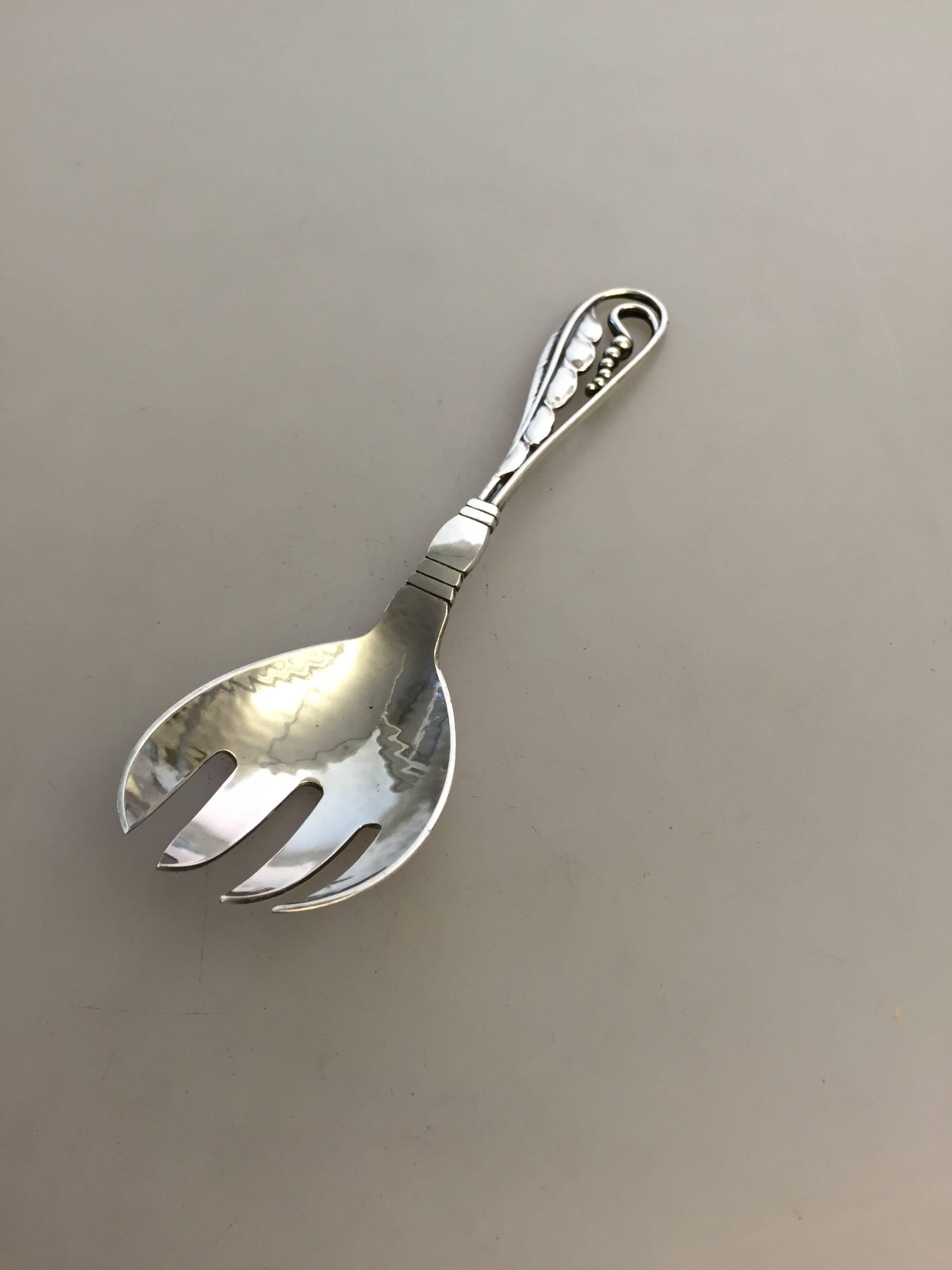 Georg Jensen sterling silver serving fork #42. From 1933-1944.

Measures: 15 cm L. 
Weighs 40 g / 1.40 oz.