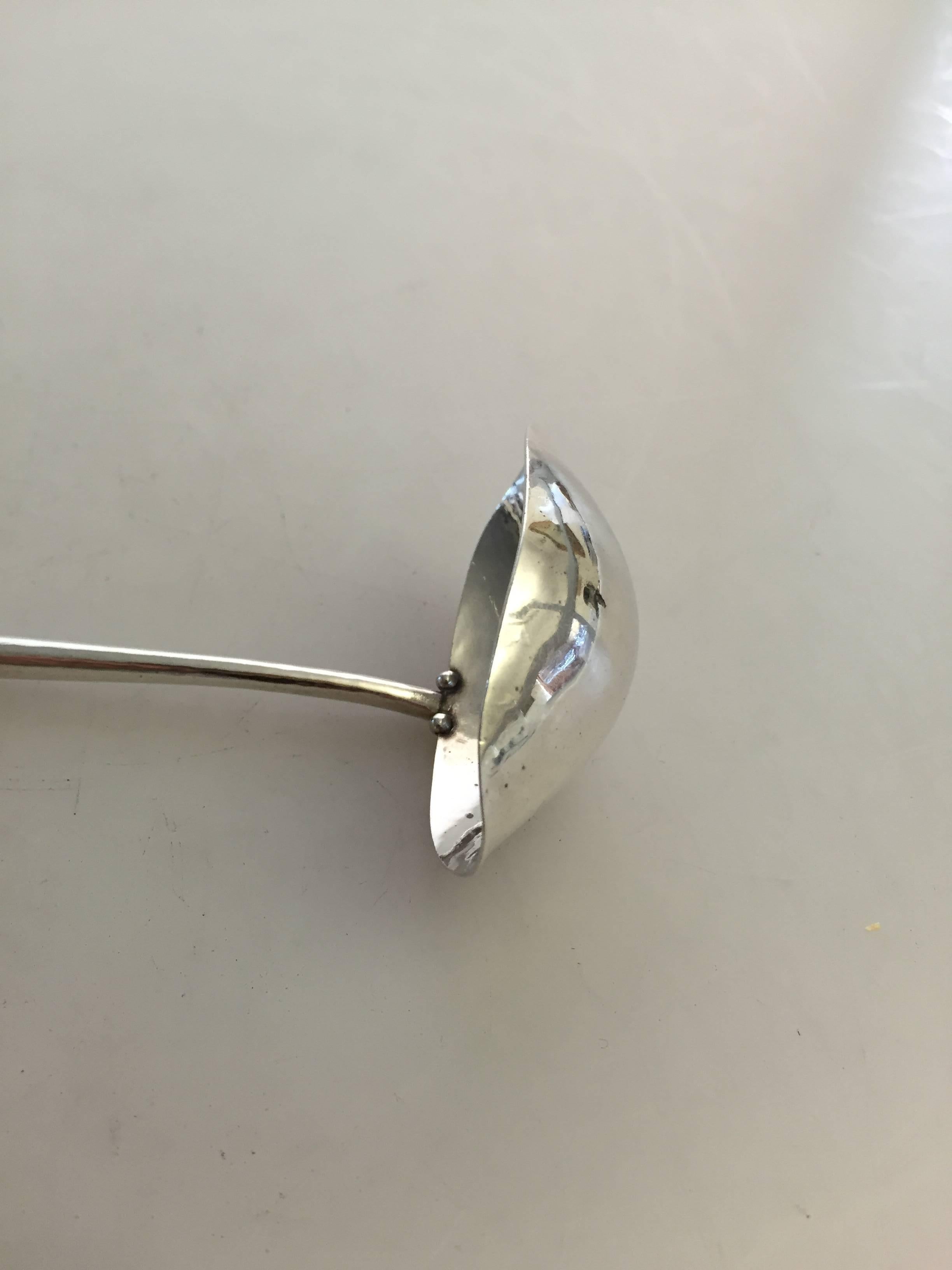 Early 20th Century Georg Jensen Sterling Silver Ornamental Sauce Spoon In Excellent Condition For Sale In Copenhagen, DK