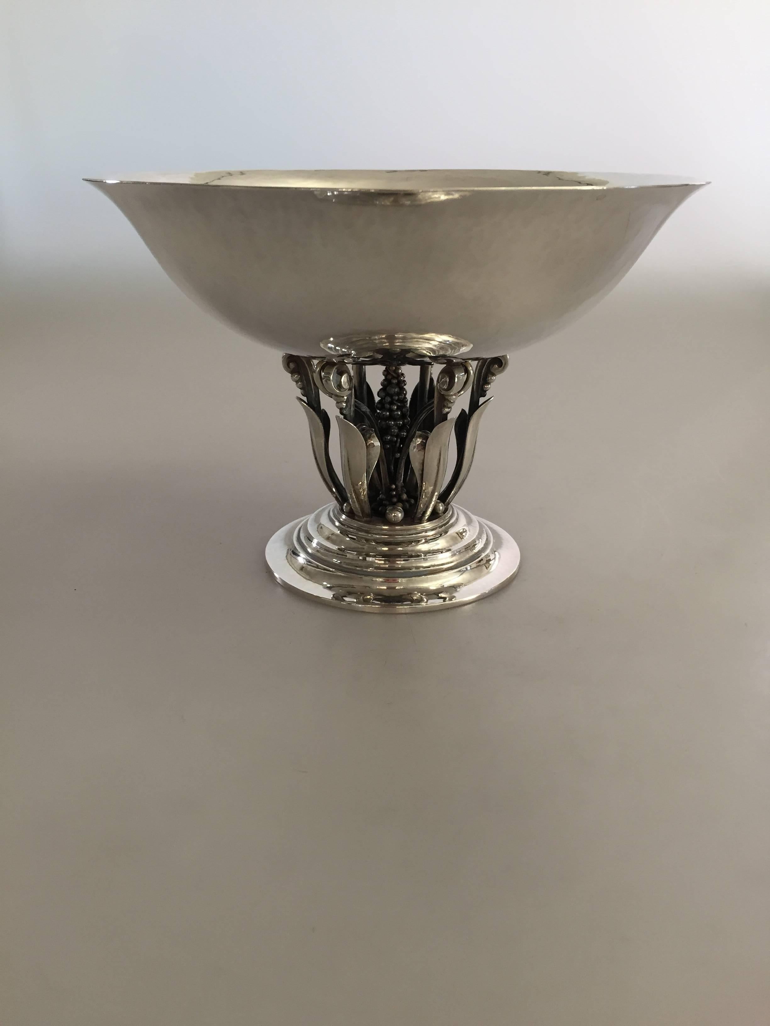 Georg Jensen sterling silver footed bowl #171. From 1920.

 Measures 20 cm diameter, 14 cm H.
 Weighs 606 g / 21.40 oz.