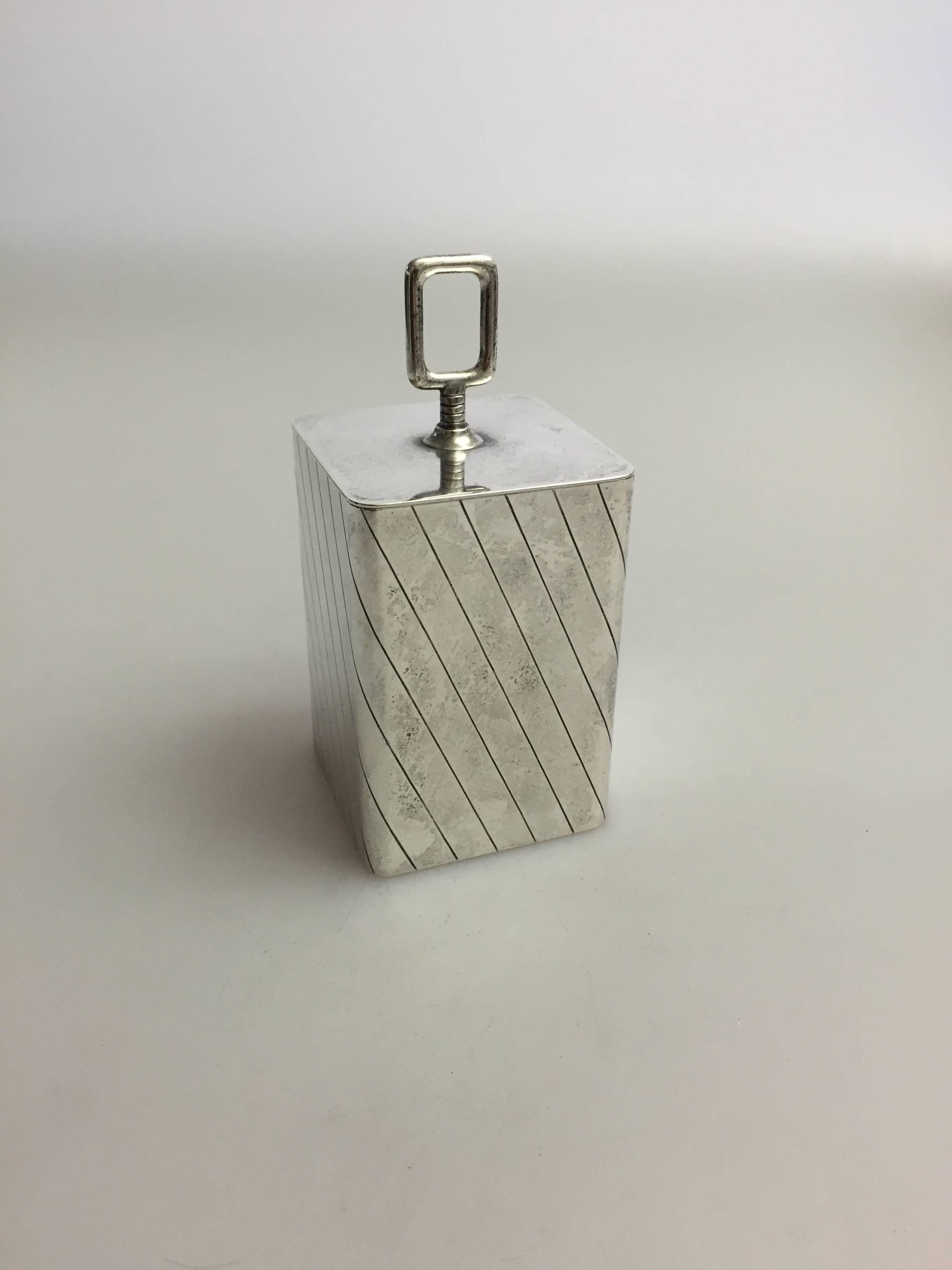 Georg Jensen sterling silver tobacco holder #913 by Sigvard Bernadotte, from after 1945.

 Measures: 13.5 cm H and 6.5cm W.
 Weighs 299 g / 10.55 oz.