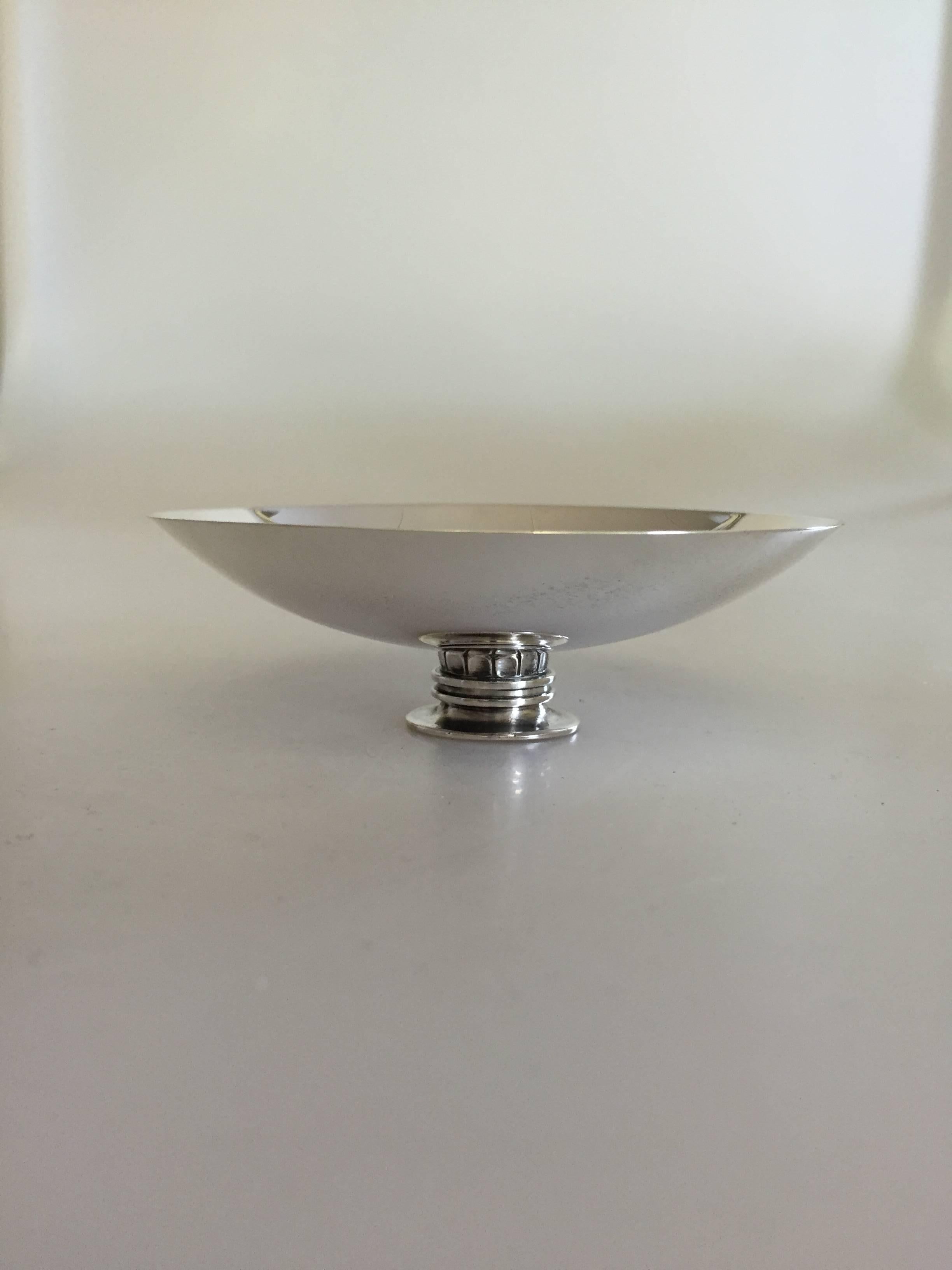 Georg Jensen sterling silver bowl/ashtray #845, from 1930-1945. 

Designed by Sigvard Bernadotte.

Weighs 110 g/3.05 oz.
Measures: 3.5 cm H, 10.1 cm diameter.
