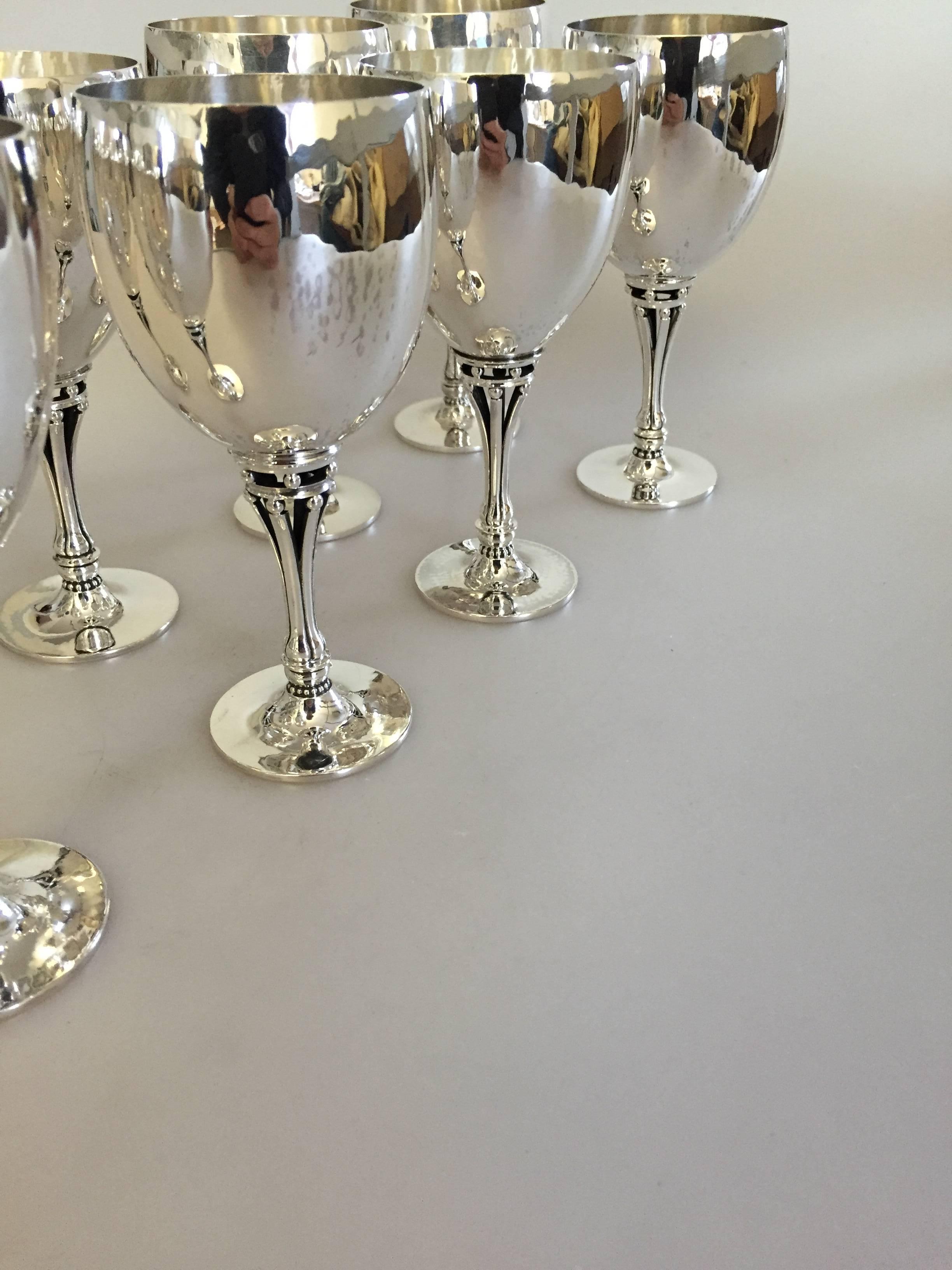 Georg Jensen sterling silver set of eight wine goblets #532B. Designed by Harald Nielsen. Four Goblets are with newer marks, while the rest are with marks from 1930-1945.

 One goblet weighs 142 g.
 Measures: 14.2 cm H, 6.5 cm dia.