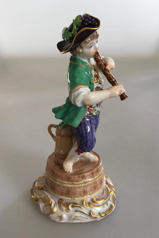 Meissen Figurine of Boy with Flute and Wine Barrel at 1stDibs
