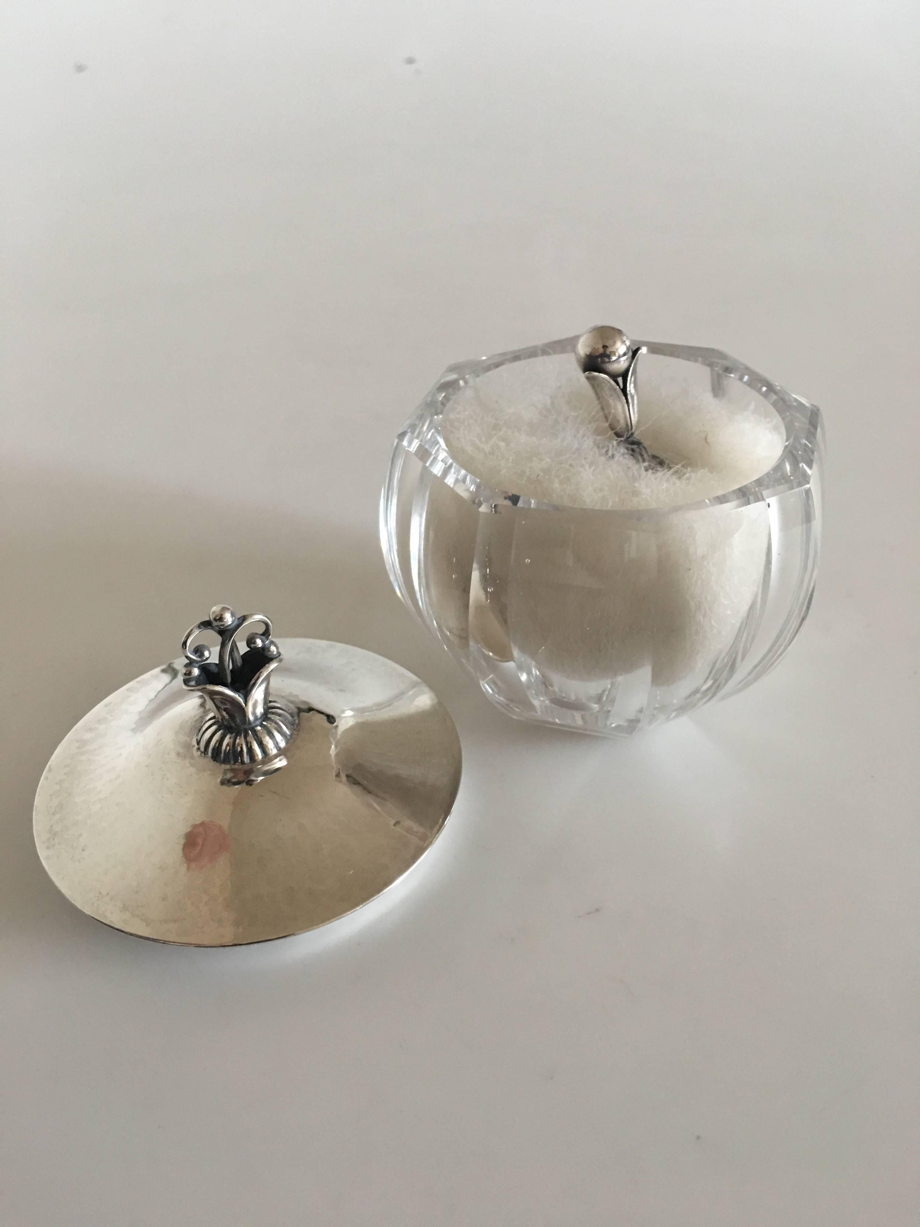 Georg Jensen body powder puff #172 in crystal jar with sterling silver Lid #172. With arly 1920s Georg Jensen Silver Marks. The glass and lid are in perfect condition. The powder puff looks nice, age considered. The glass measures 5.5 cm H (2