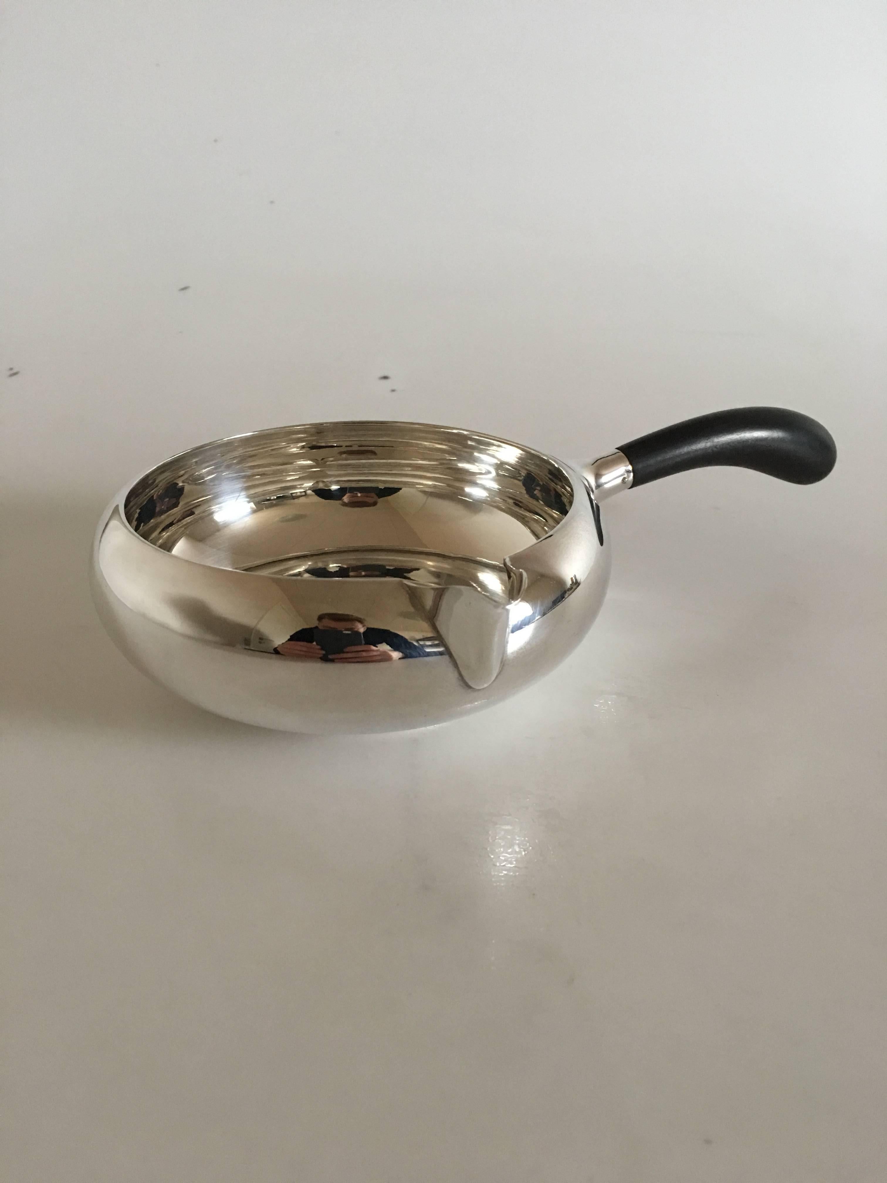 Svend Toxværd silver sauce bowl with wooden handle. Measures 14 cm diameter (5 33/64