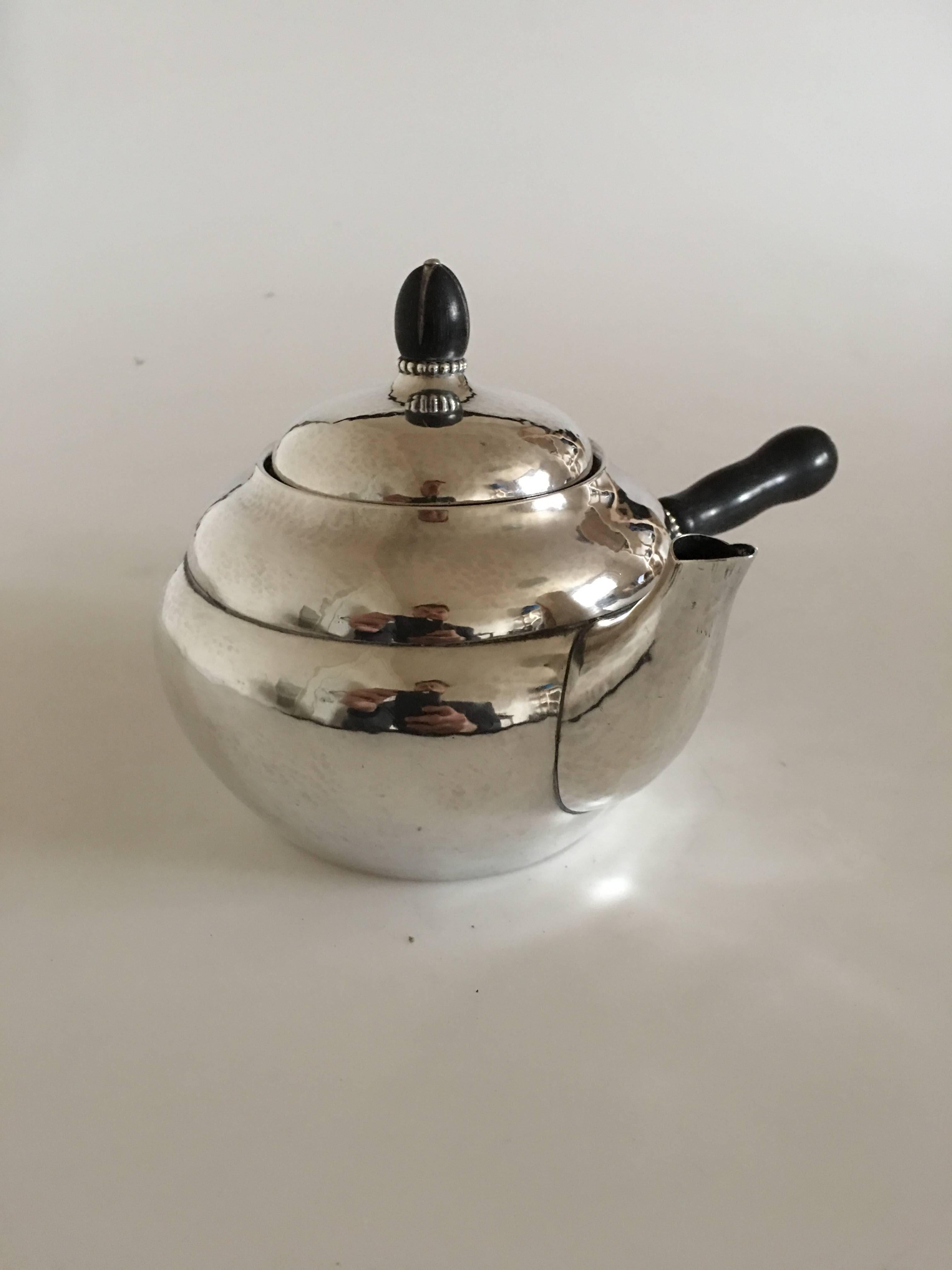 Georg Jensen sterling silver tea pot #1A with ebony, from 1915-1930. Measures 10 x 13.5 cm. Weighs 342 grams (12 oz).