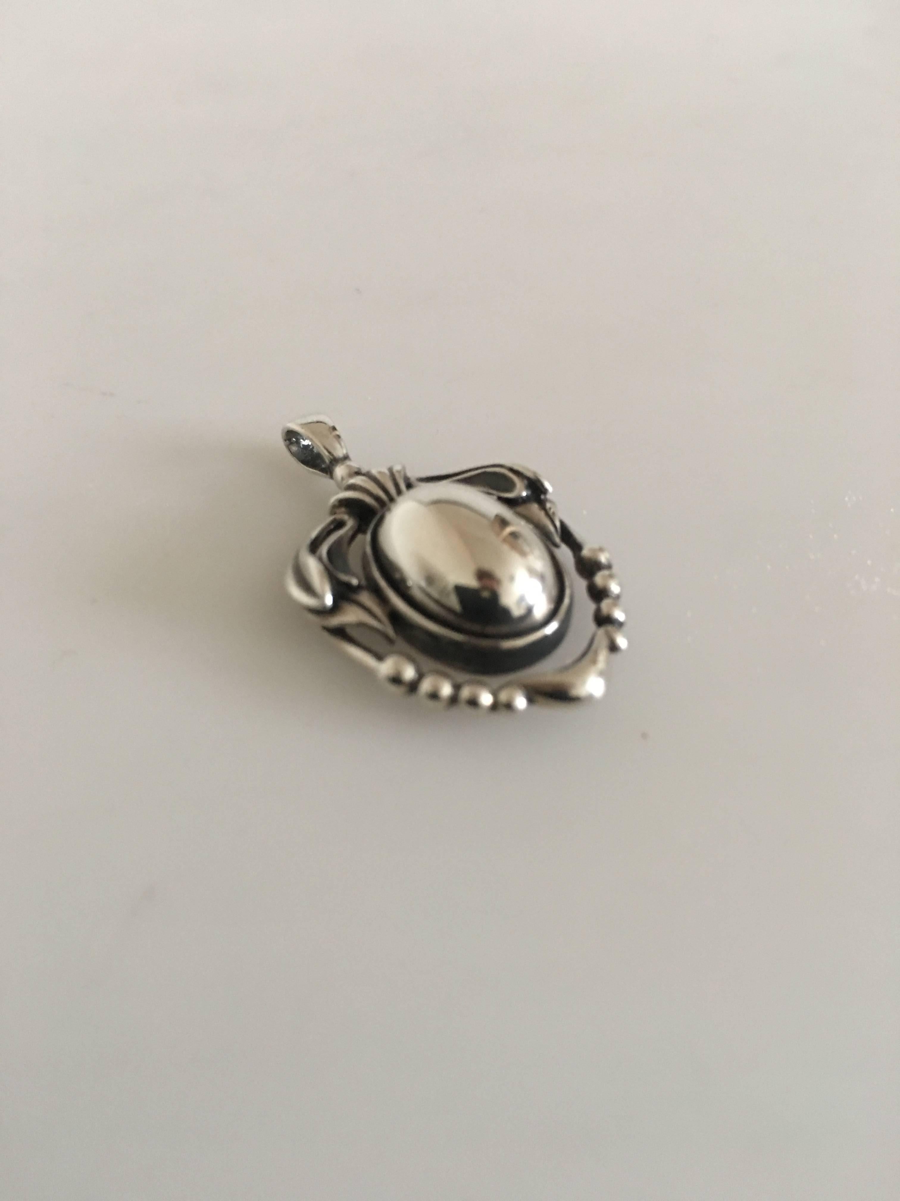 Georg Jensen sterling silver 2014 annual pendant with silver stone. Measures: 3 cm (1 3/16