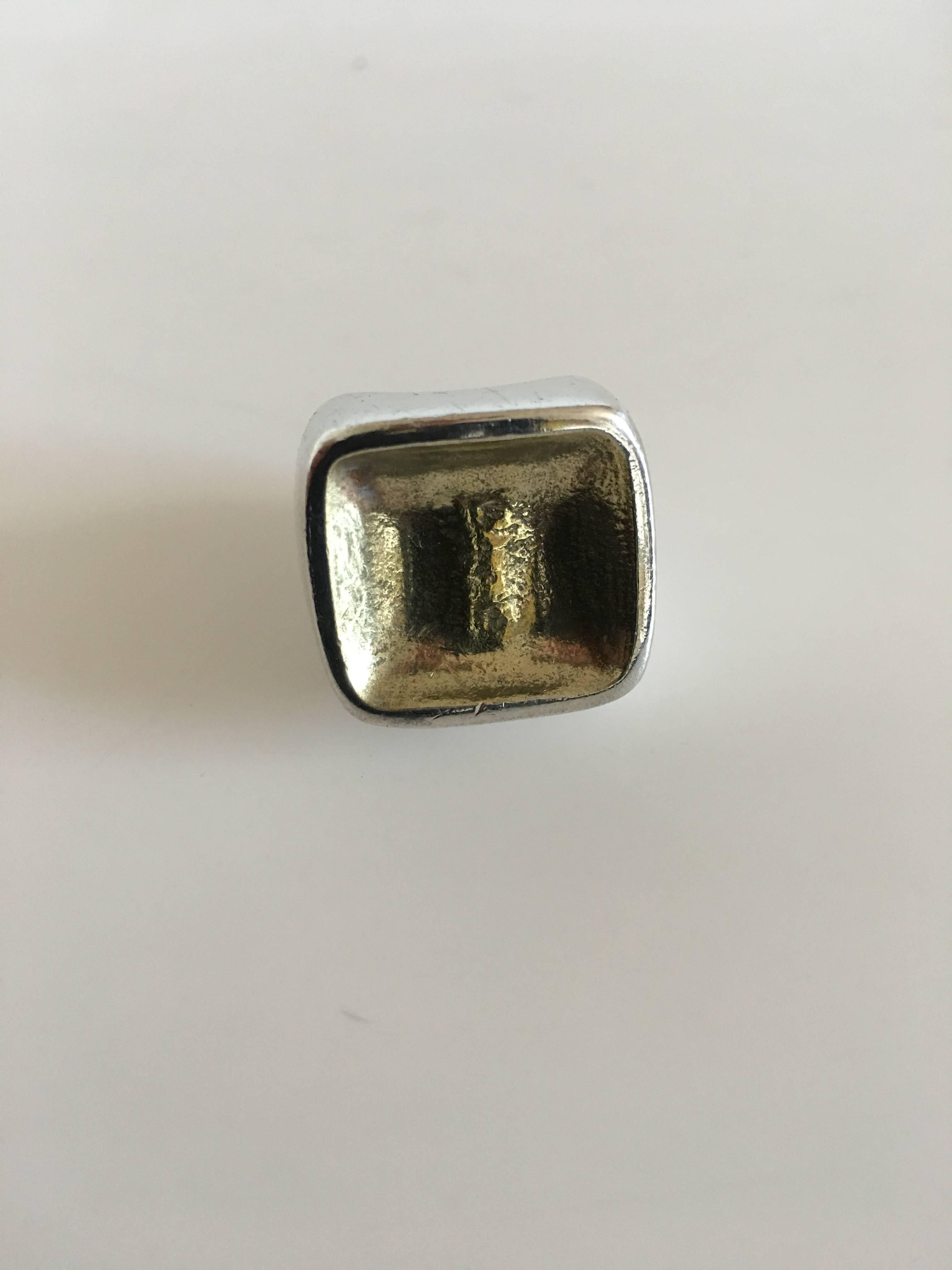 Hans Hansen sterling silver ring with gilded top. Size 53 (US Size 6½). Weighs 25 grams (0.80 oz). Measures 2 x 2 cm (0 25/32