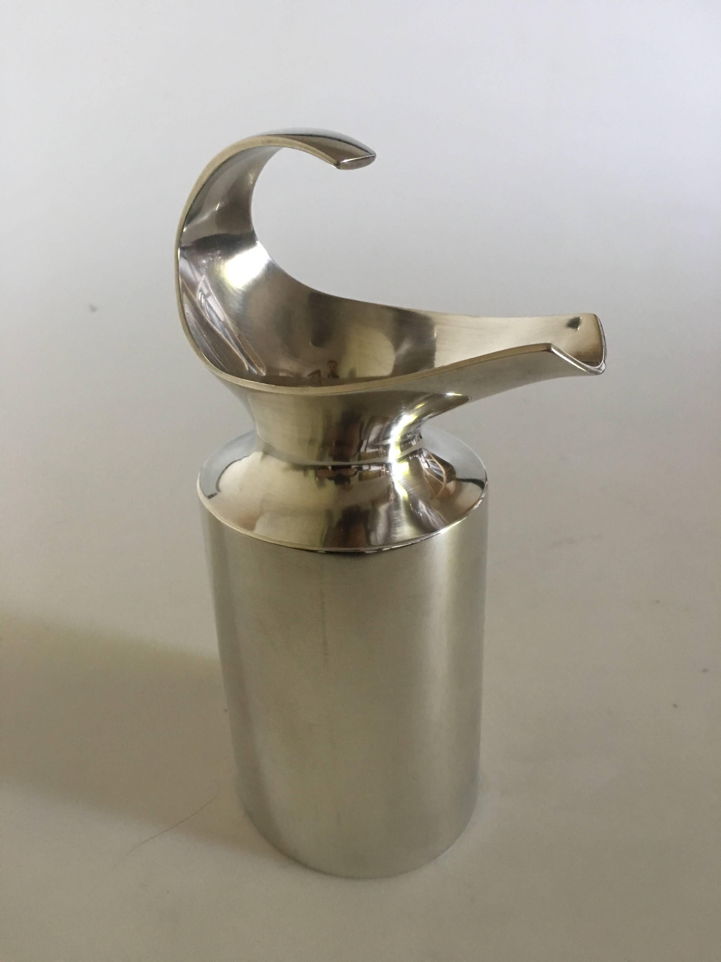 Hans Hansen sterling silver pitcher from 1987. No. 12/100. Measures 18.5 cm to the handle. Oval diameter of 7.7 cm. Weighs 399 grams. Matt polished silver. Designed by Karl Gustav Hansen.