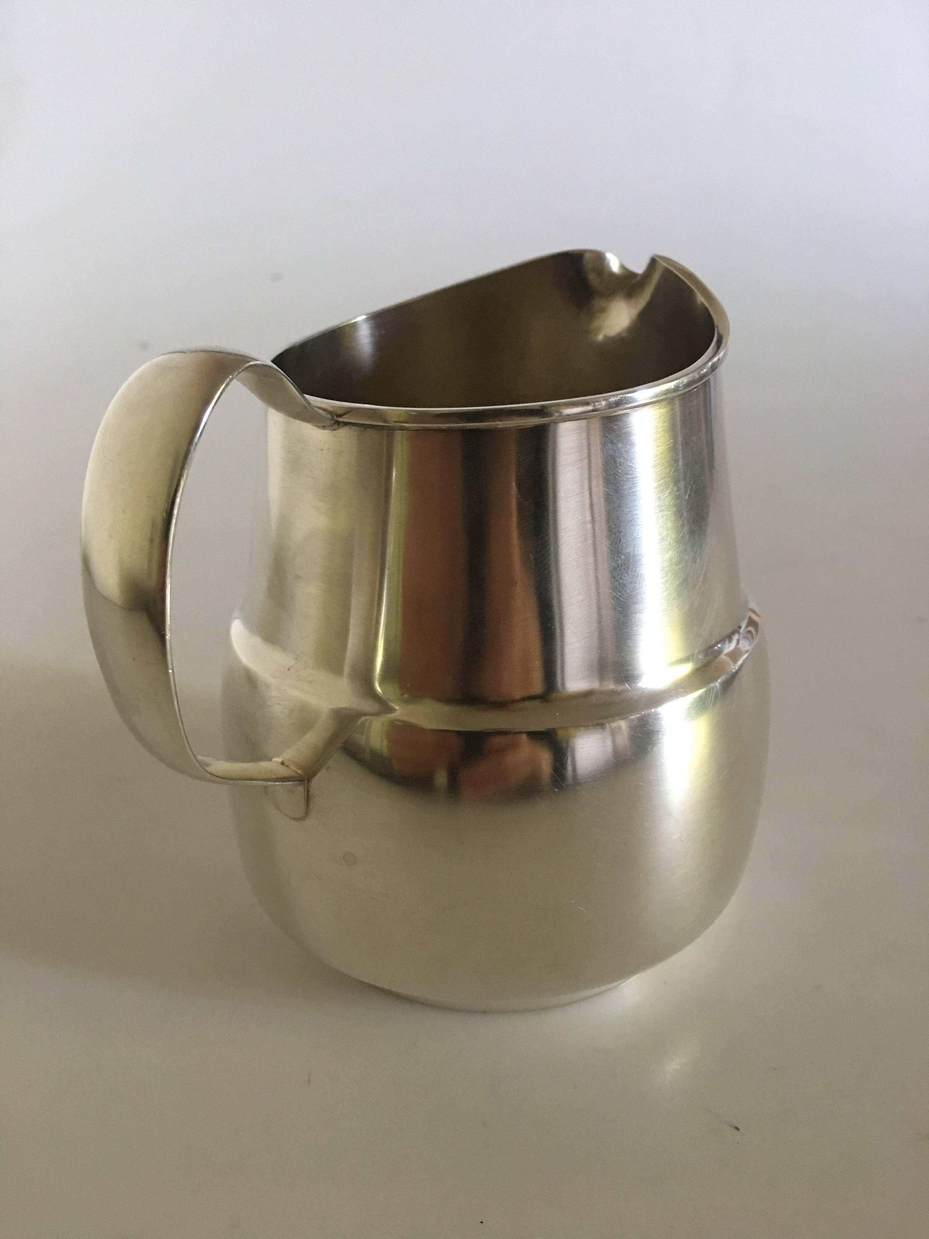 Hans Hansen pitcher in sterling silver designed by Karl Gustav Hansen in 1989.

Done as a yearly hollowware piece in 100 copies.

Measures 11.5cm / 4 1/2