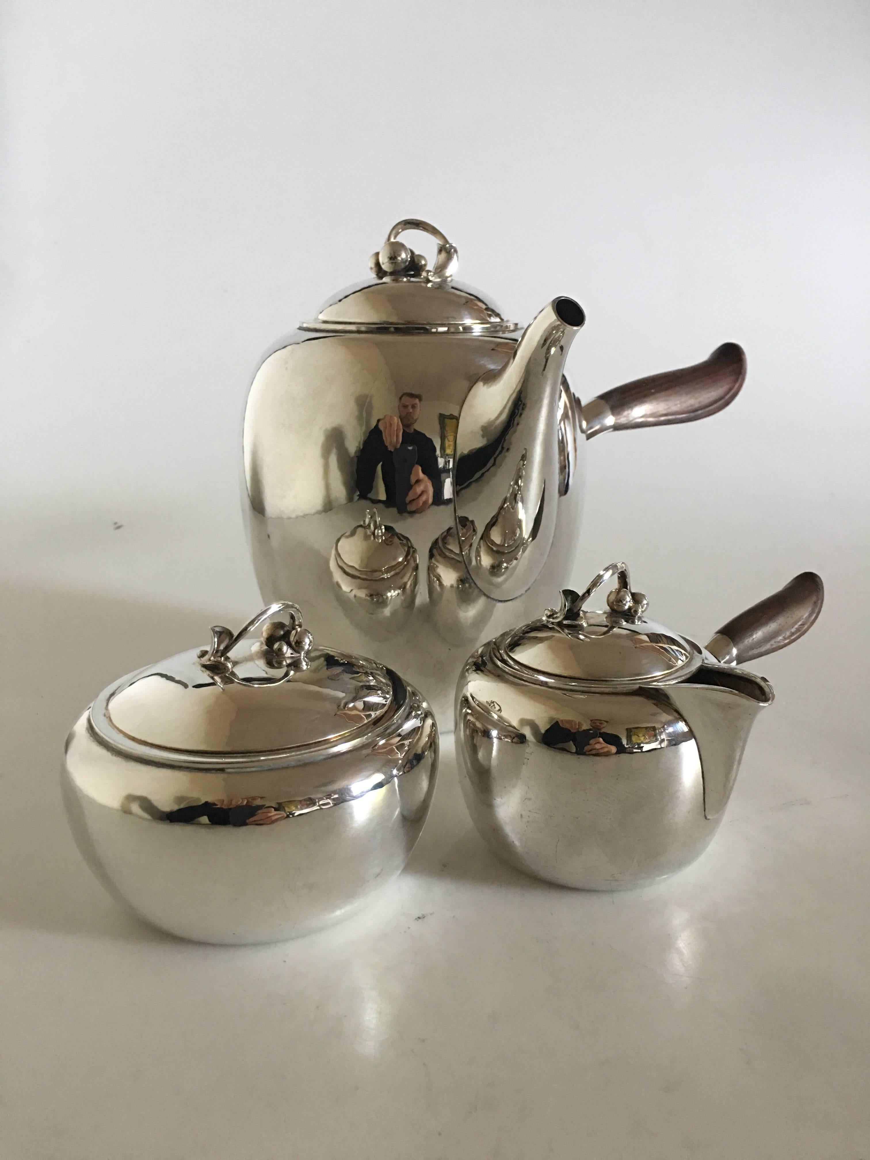 Georg Jensen sterling silver coffee pot, creamer, sukker bowl by Harald Nielsen #875. Pot measures 22.5cm x 16.5cm, creamer 15cm x 9cm and sugar 10cm x 7.5cm. In perfect condition.