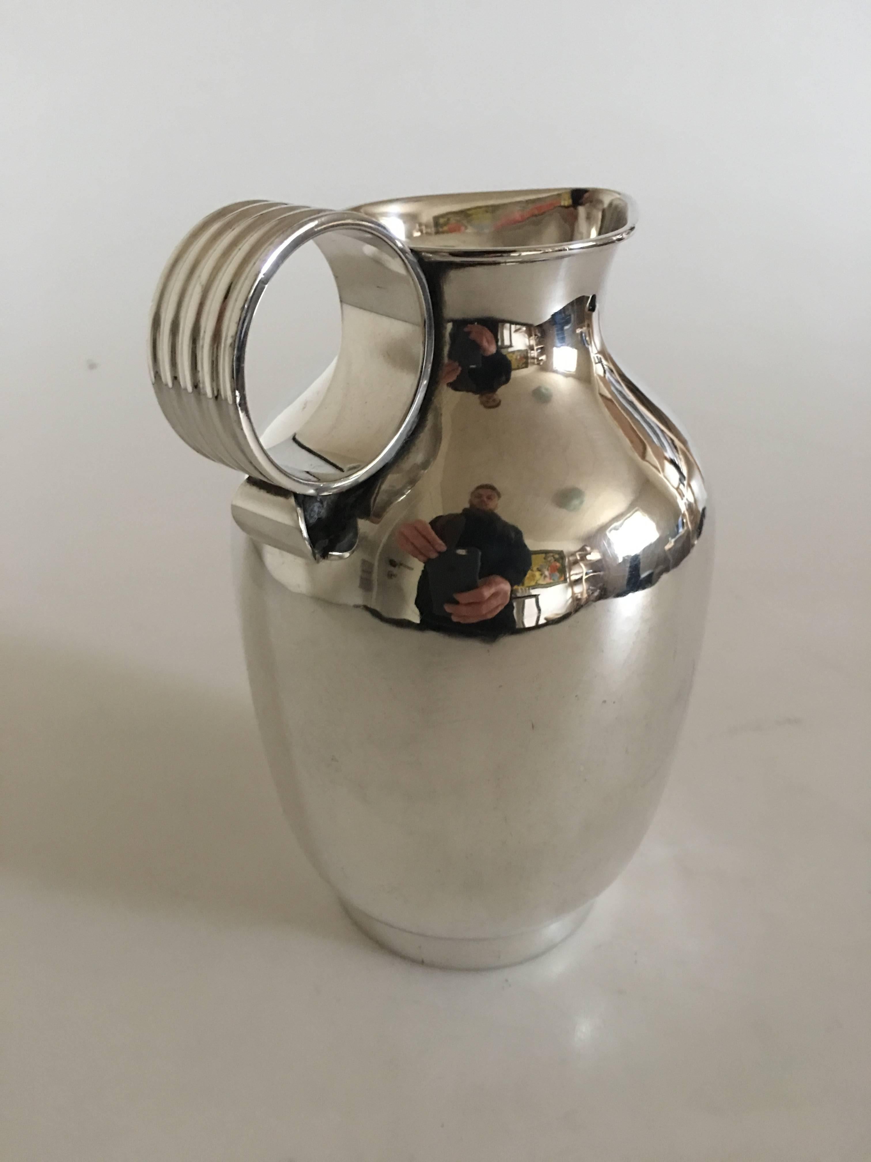 Georg Jensen sterling silver jug with round handle no. 744 by Gustav Pedersen. Measures: 16.5 cm h (6 1/2