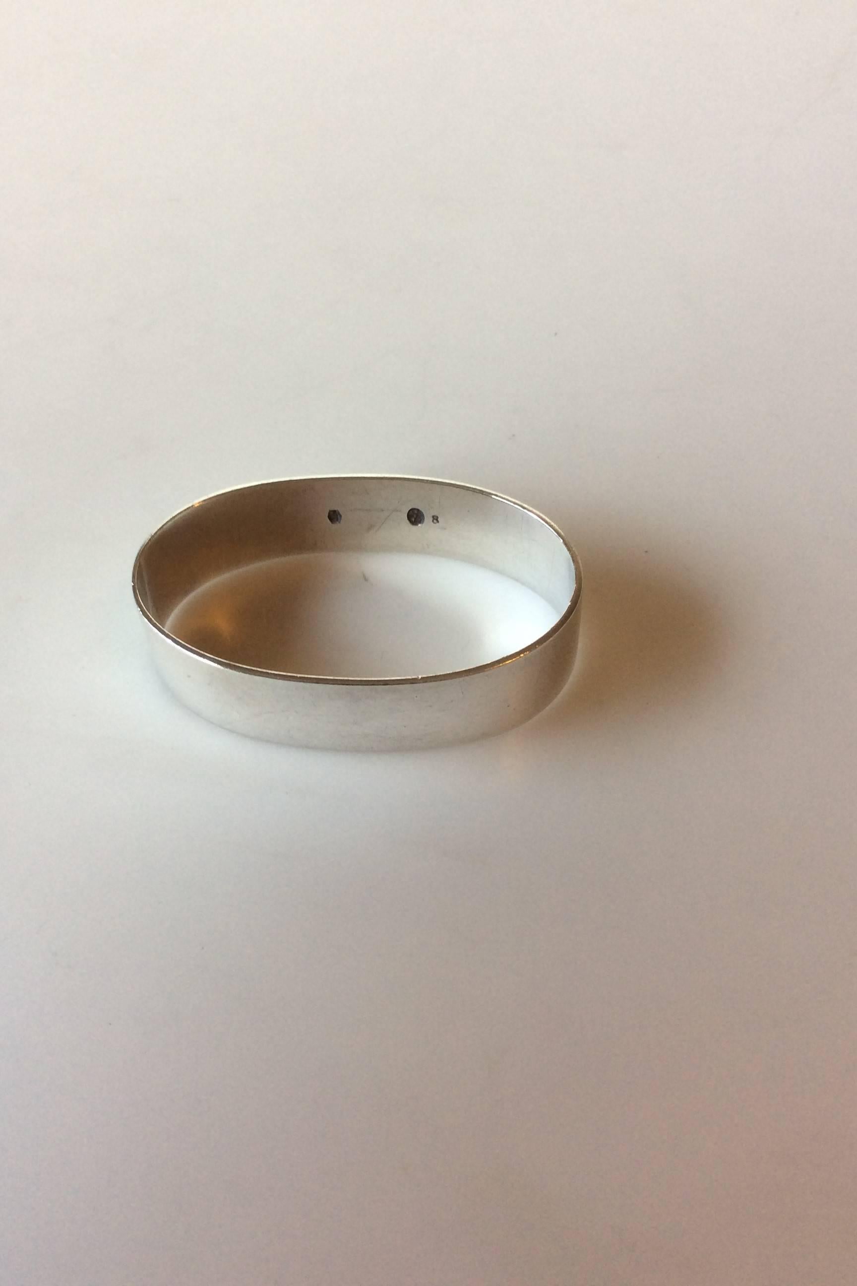 Silver napkin ring with freemason symbol, 830 S, DG, No 8. Measures: 5.3 x 3.4 x 1.4 cm / 2 3/32 x 1 11/32 x 0 35/64 in.