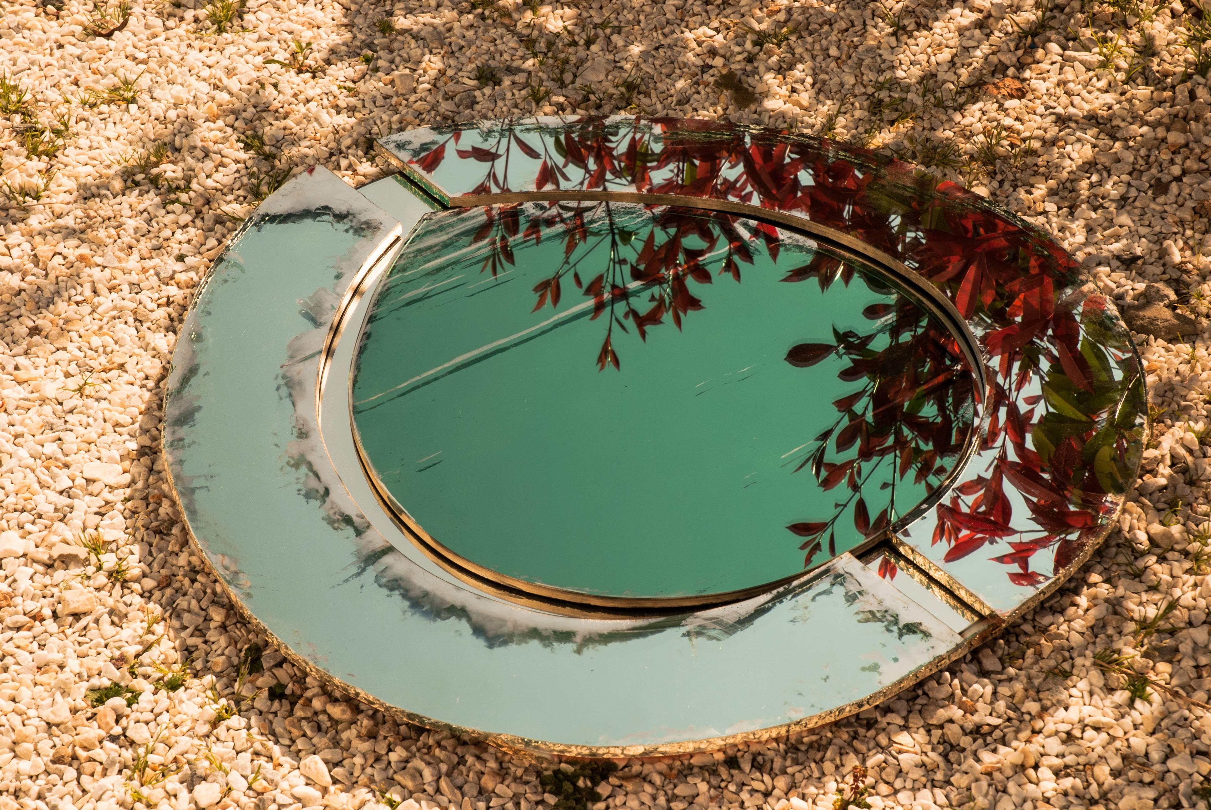 This wall mirror is entirely handmade in Tuscany Italy in the atelier of Sabrina Landini. 
The glass is original of 1970, the slabs are available in color Jade and aquamarine.
After the tailor-made cut, according to customer's requests, Sabrina will
