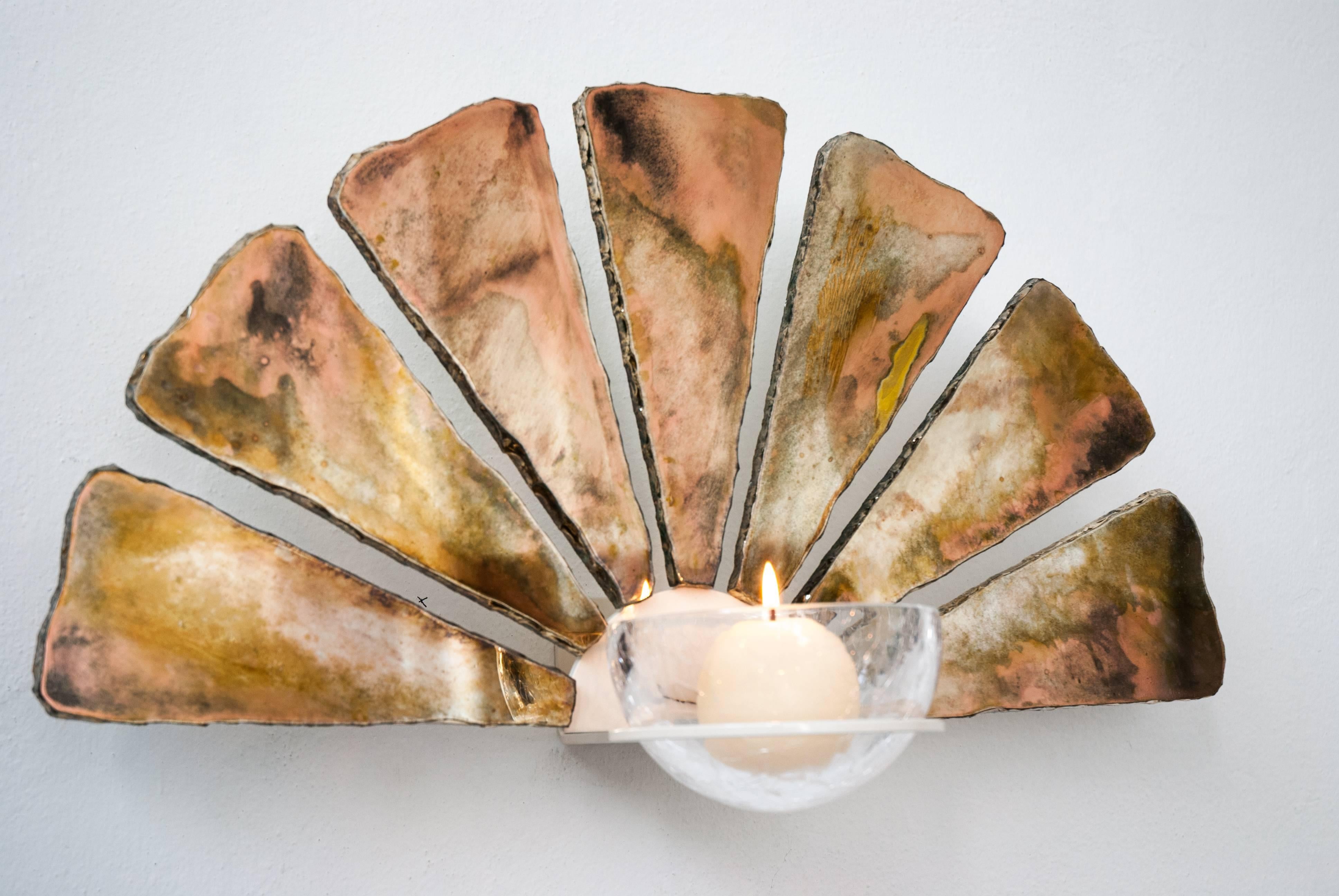Little fan wall sconce lighted with led light on the back side, with candle holder on the front side art glass, Sabrina’s silvering, ivory metal body. Suitable next to the bed as side bed lighting, on a corridor next to a mirror or a painting.
