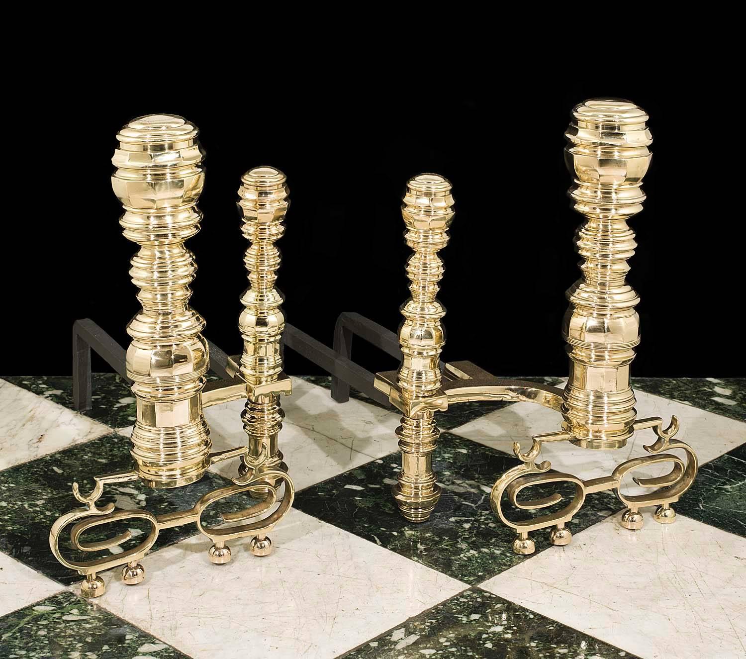 A large pair of antique Baroque style brass andirons with double back bars and raised on elaborately scrolled feet.
American, mid-19th century.
 