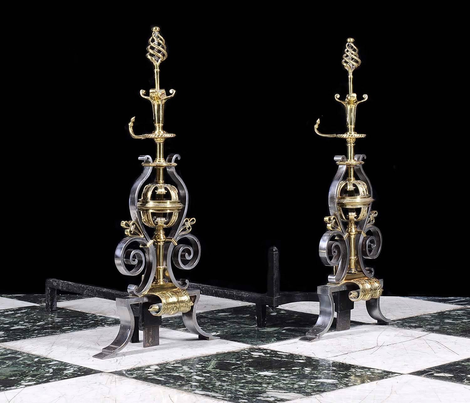 A pair of 19th century polished steel and brass andirons with spiral finials on turned columns hung with central pierced globes within scrolled decoration supported on pairs of splayed feet,

English, late 19th century.

(Price and vat in EU