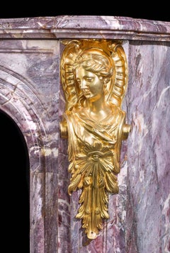 Cheminée rococo ancienne de style Louis XV en marbre Fleur de Pecher