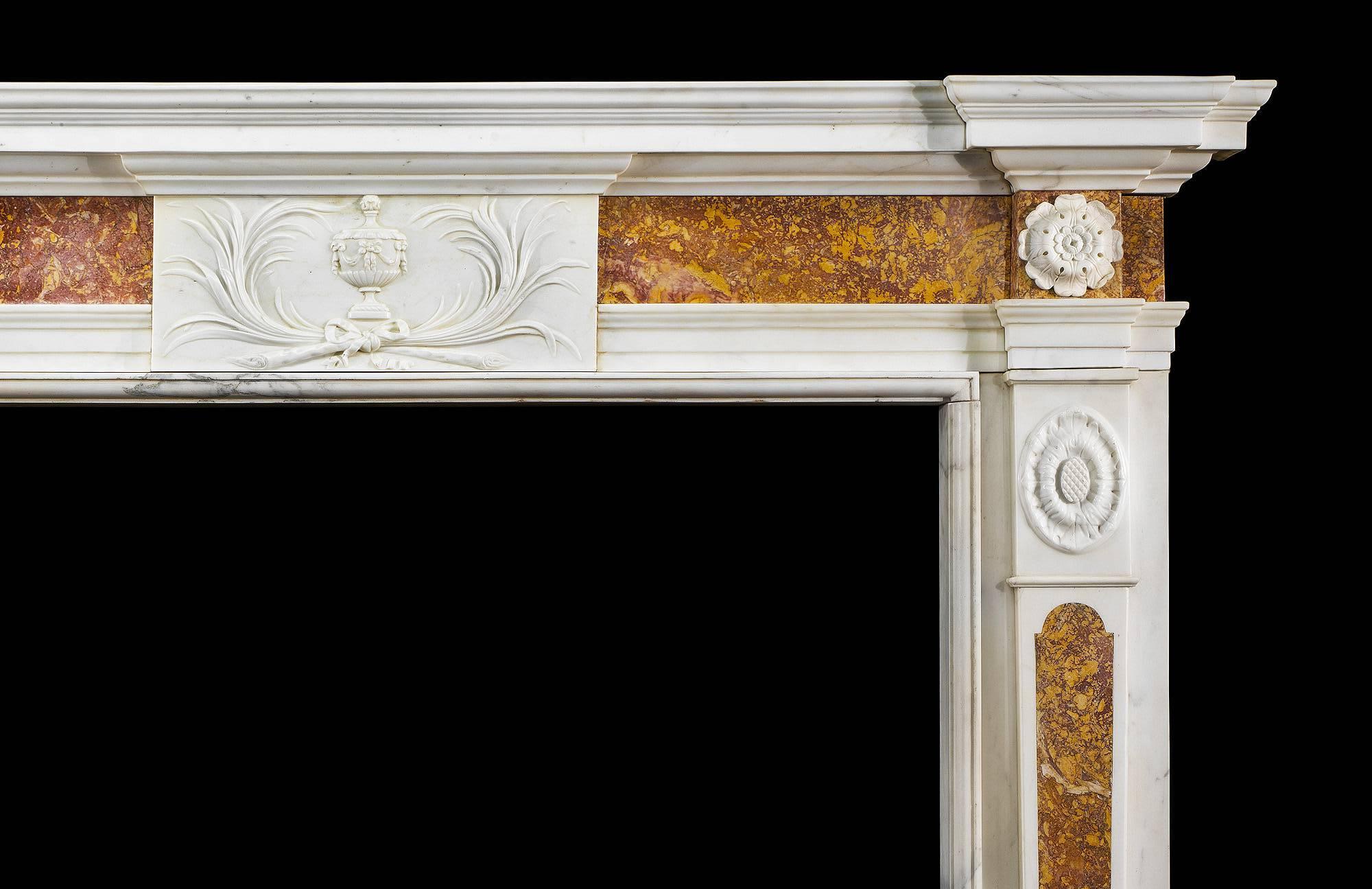 A very smart late 18th century statuary and Spanish brocatelle marble chimneypiece, the central tablet carved with exquisite crossed leaf fronds and classical urn to the highest quality. The end blocks carved with rosettes common to the period with