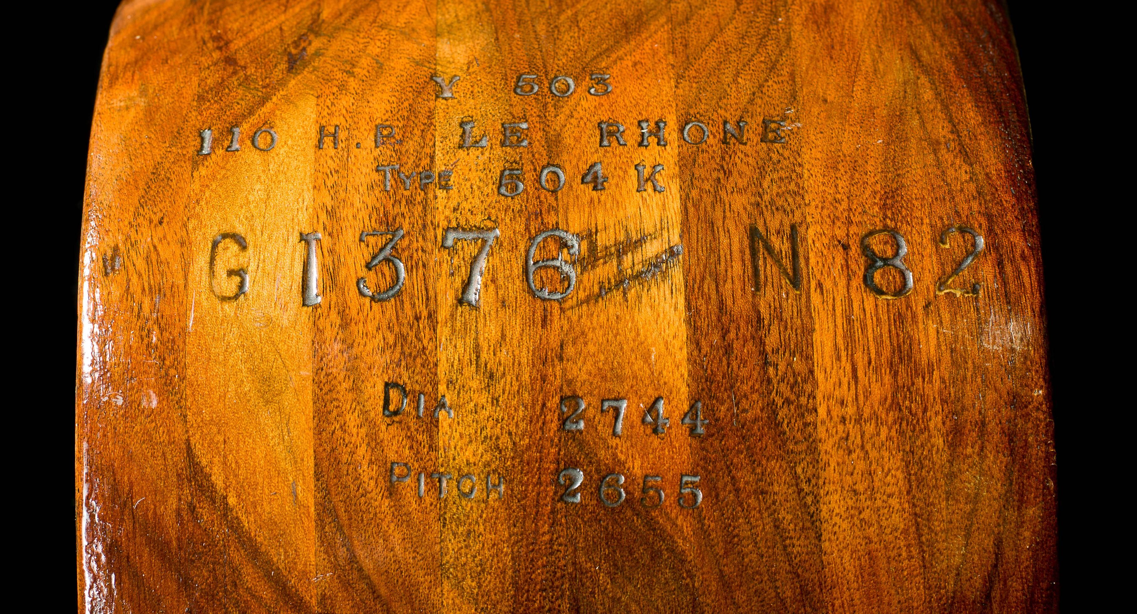 A historic propeller from the Le Rhone Rotary engine of an Avro 504 airplane. This fine early, large laminated, mahogany and oak propeller, made circa 1919 bears identification stamps indicating its British Air Ministry registration, and technical
