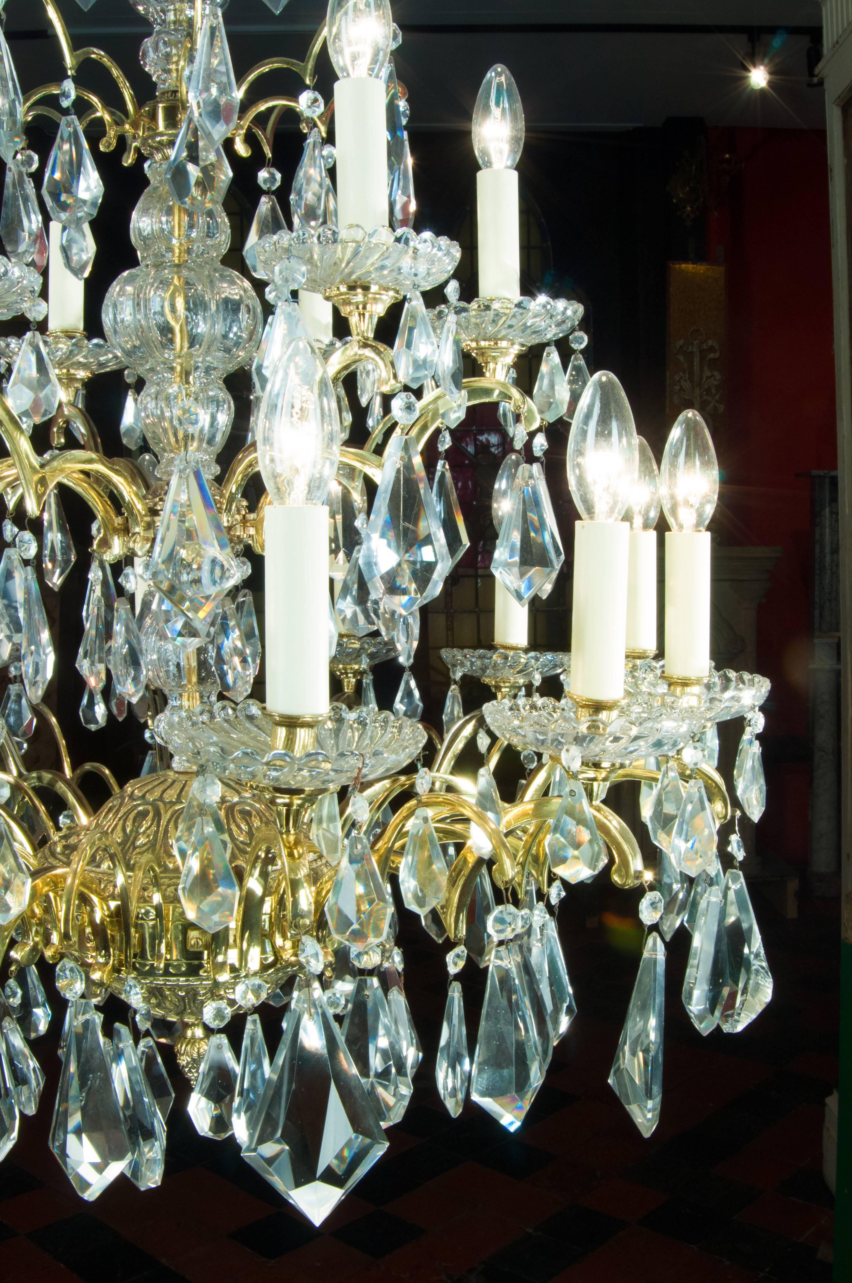An impressive large eighteen branch two-tier bronze and cut crystal chandelier, beautifully hung with large pendant and bead drops. Converted to electricity. 

Spanish, early 20th century. 

(Price + vat in EU zone).
 