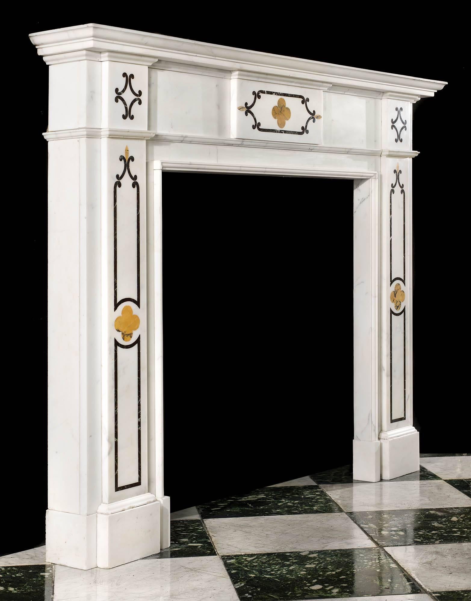 An attractive Victorian marble antique chimneypiece in pure white statuary marble, inlaid with Sienna and Verde Antico marble. The plain frieze has a central inlaid panel flanked by simple end blocks. The jambs have further inlaid Gothic style